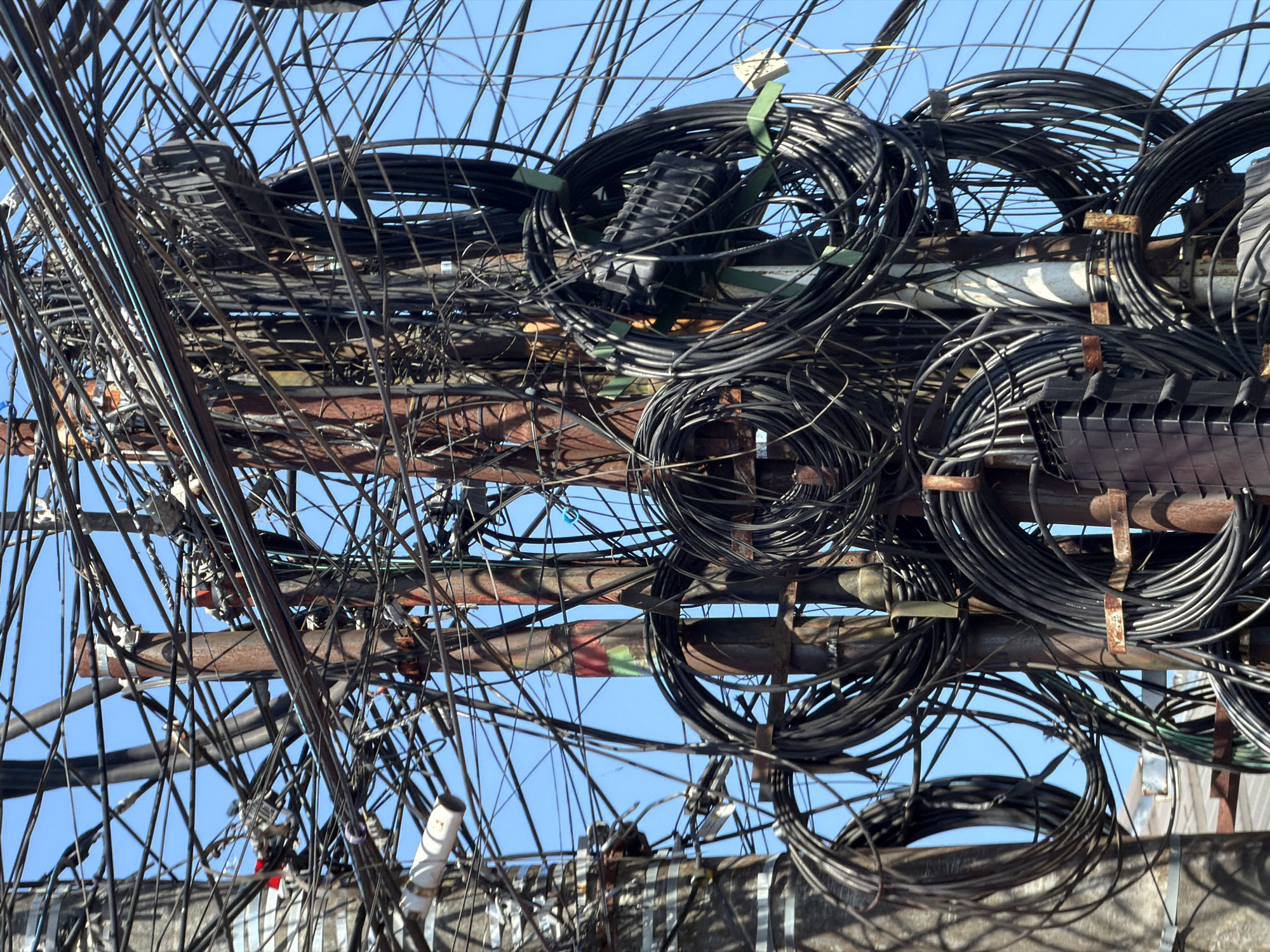 Morning commute captures Kuta Selatan's tangled utility infrastructure