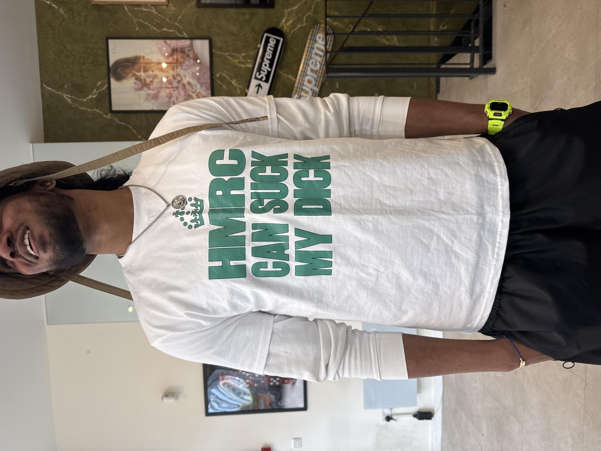 London indoor scenes feature protest shirt, football support message
