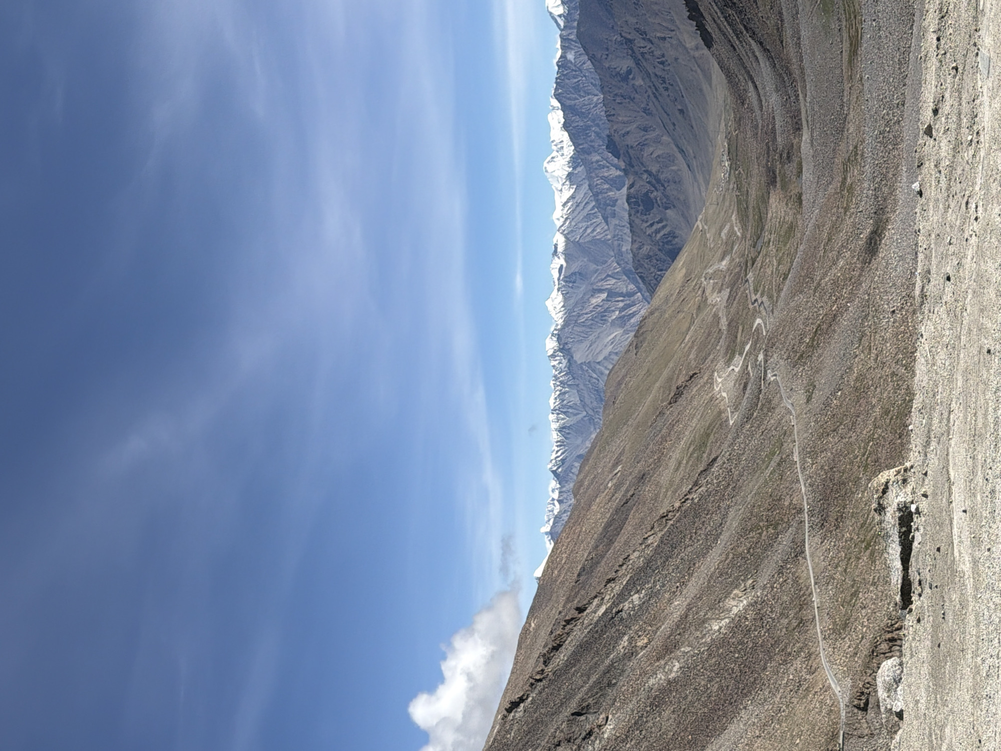 Loaded Royal Enfield parked on rugged high-altitude roads near Leh