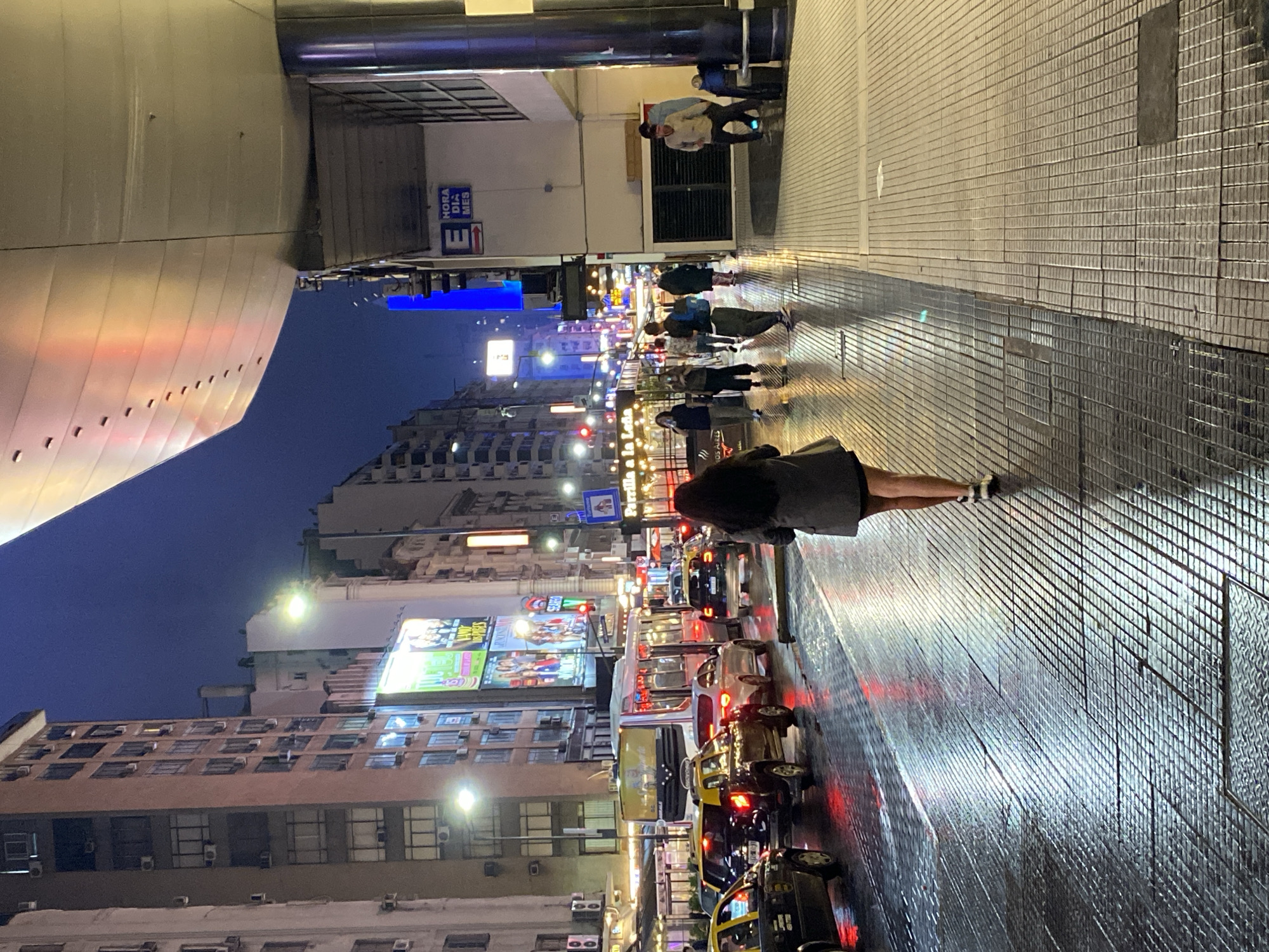 Rainy night scenes documented across central Buenos Aires theaters district