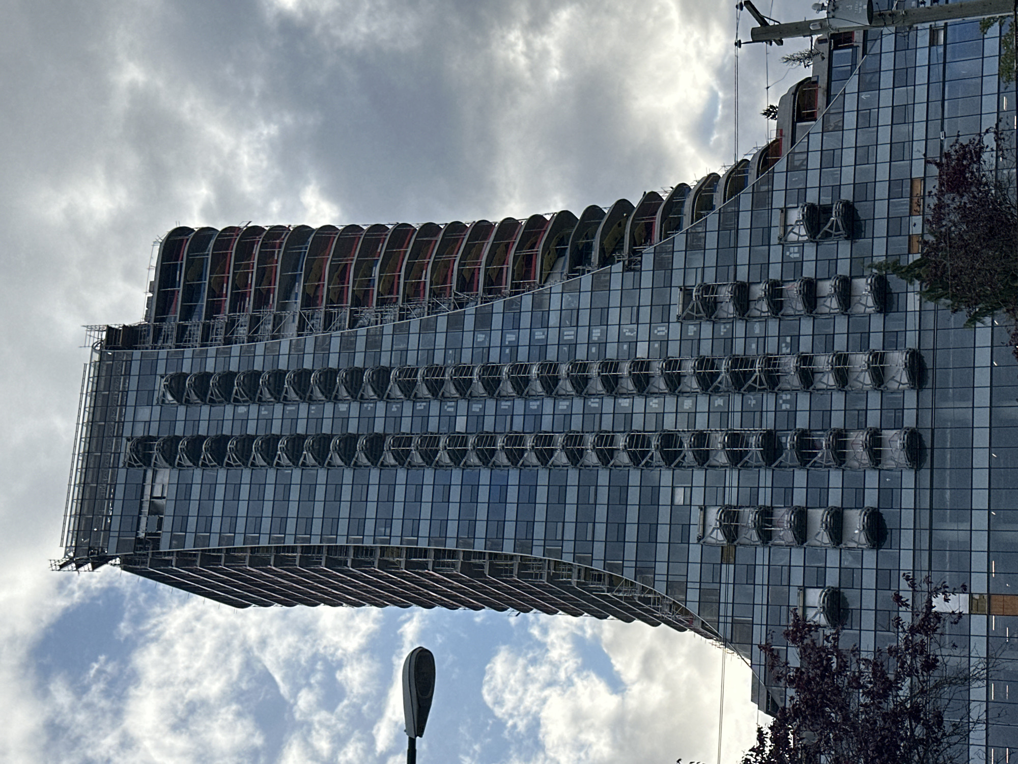 Modern curvilinear high-rise under construction documented in Vancouver