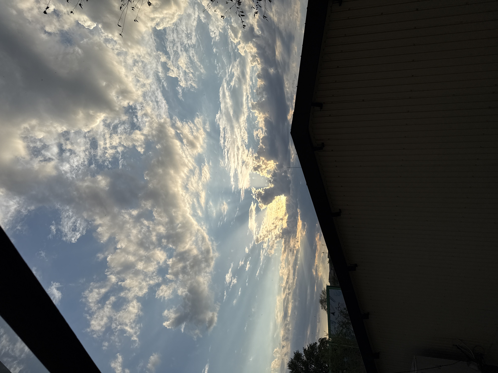 Crepuscular rays break through storm clouds over Lobacheve