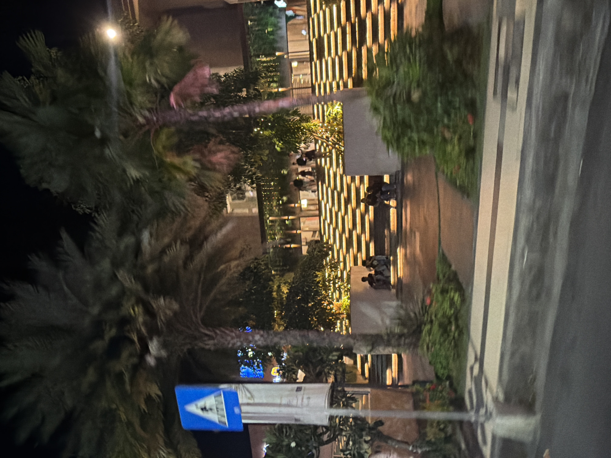 Kuta's neon-lit hotel strip on a busy night