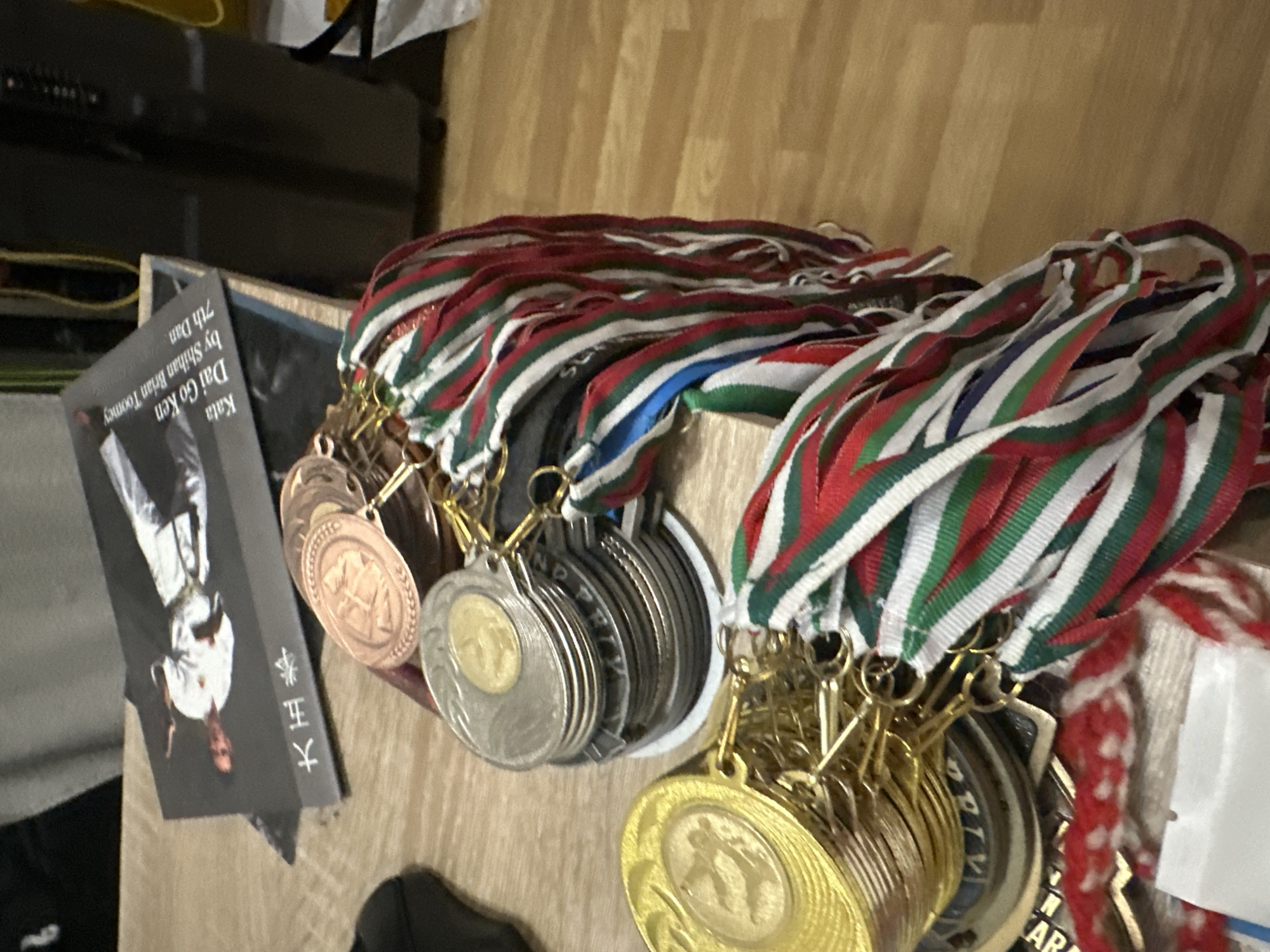 Person documents personal collection and fitness achievements indoors