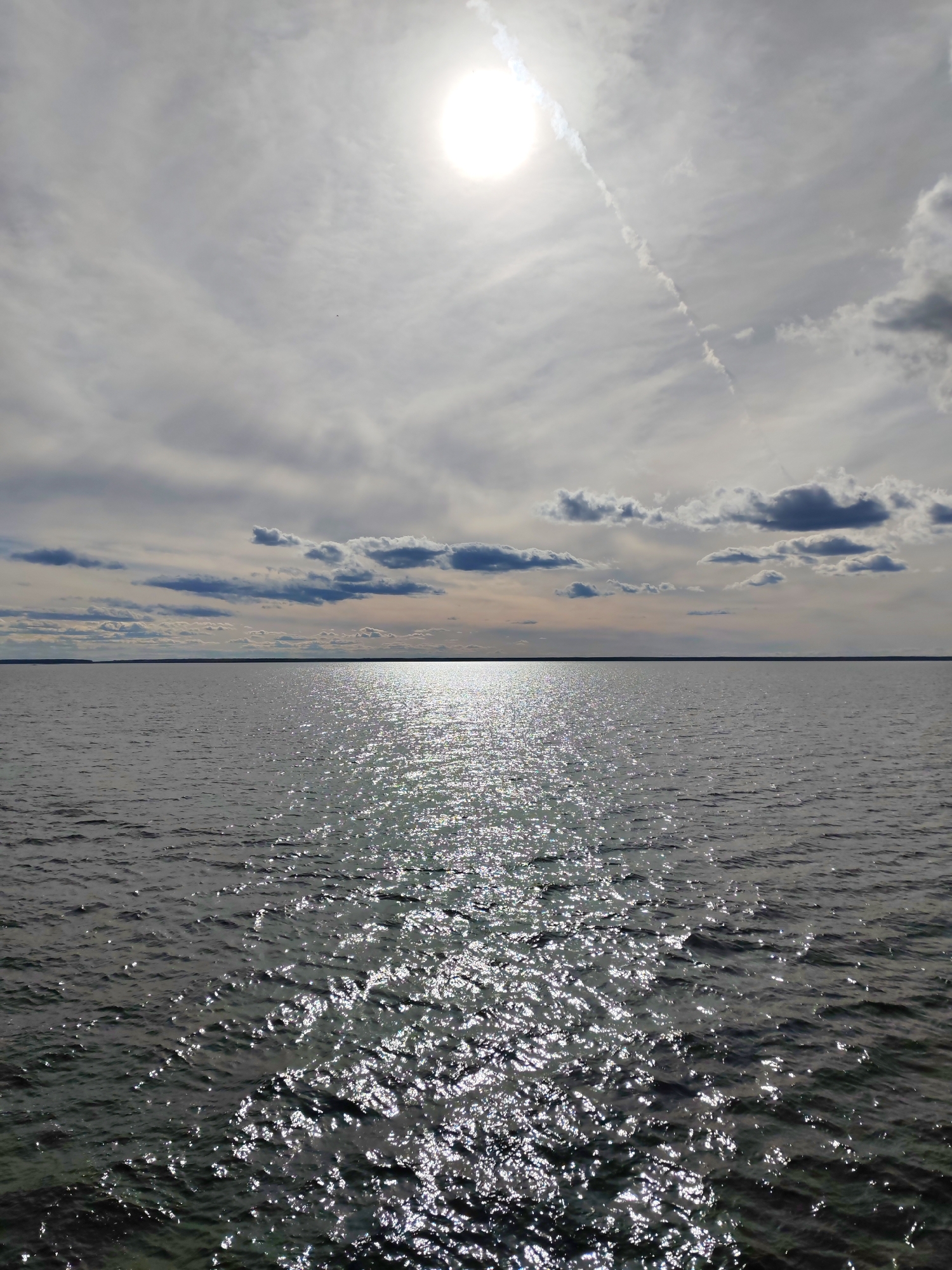 Sunlight reflects across water surface near Gorushka, Russia