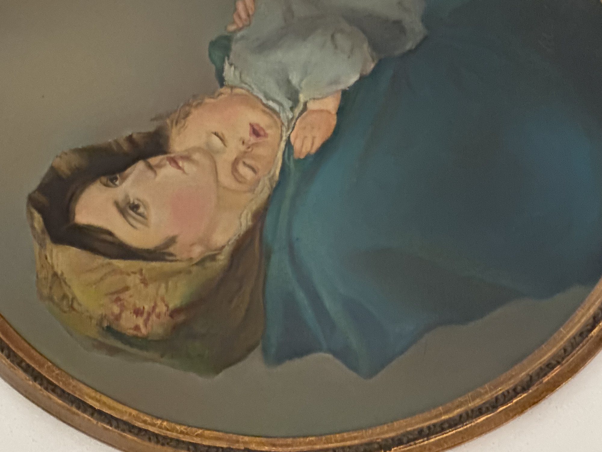Framed painting of woman with baby documented in Puebla
