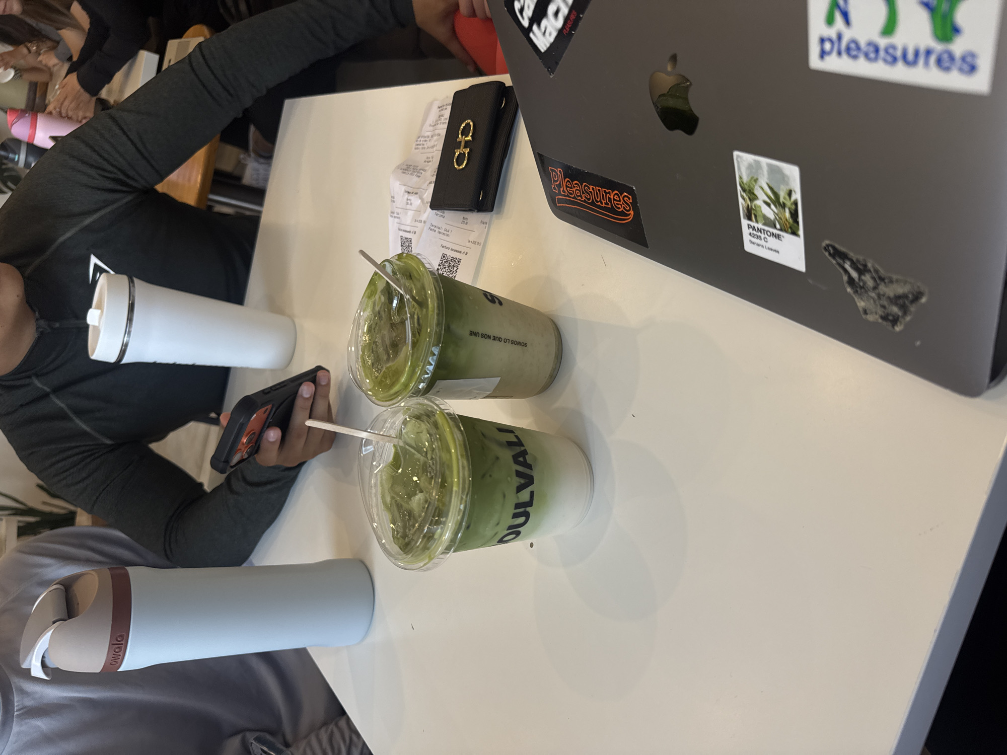 Young men share matcha drinks at Puebla cafe