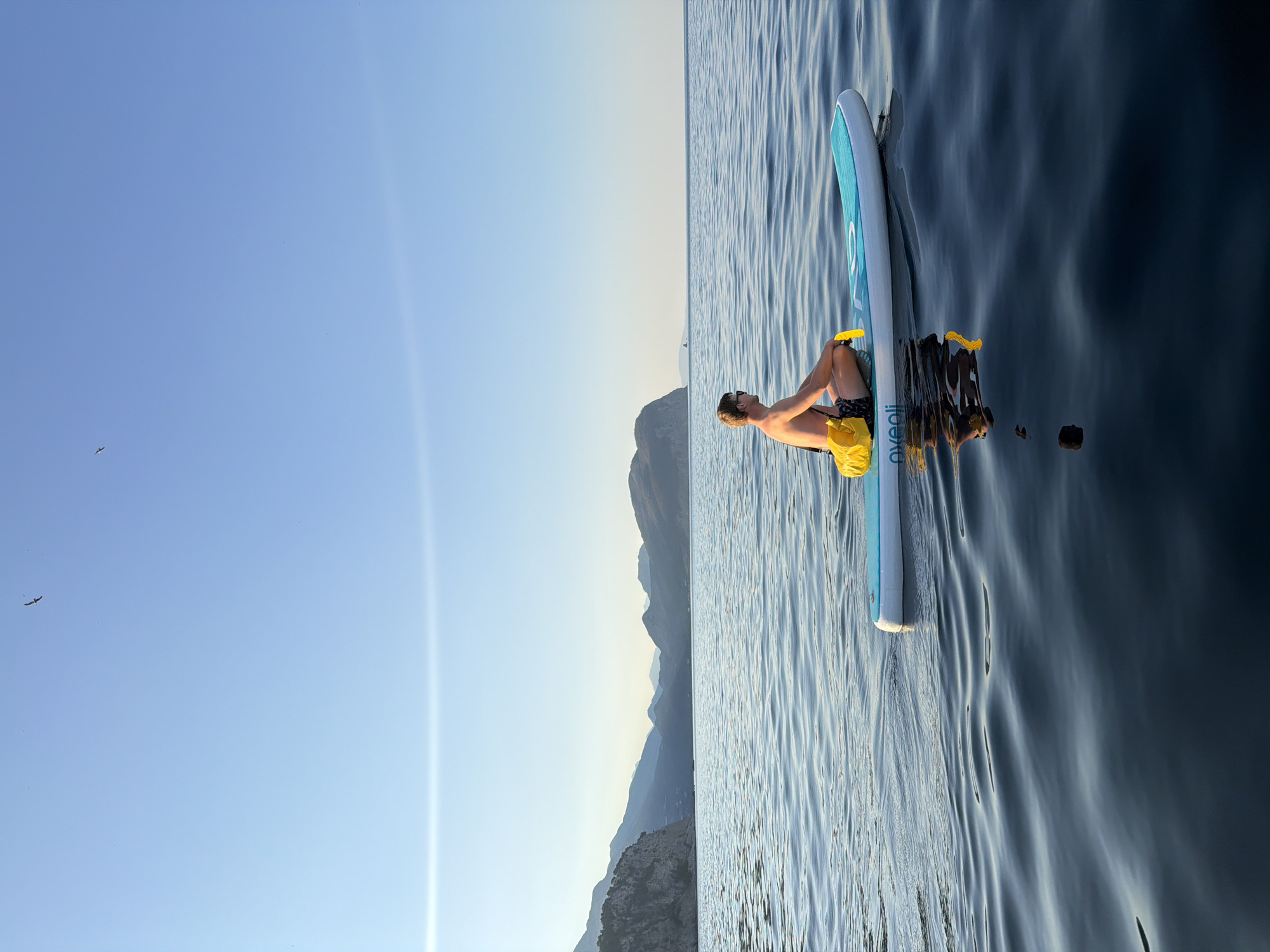 Paddleboarding around Petrovac's coastline and chapel islet