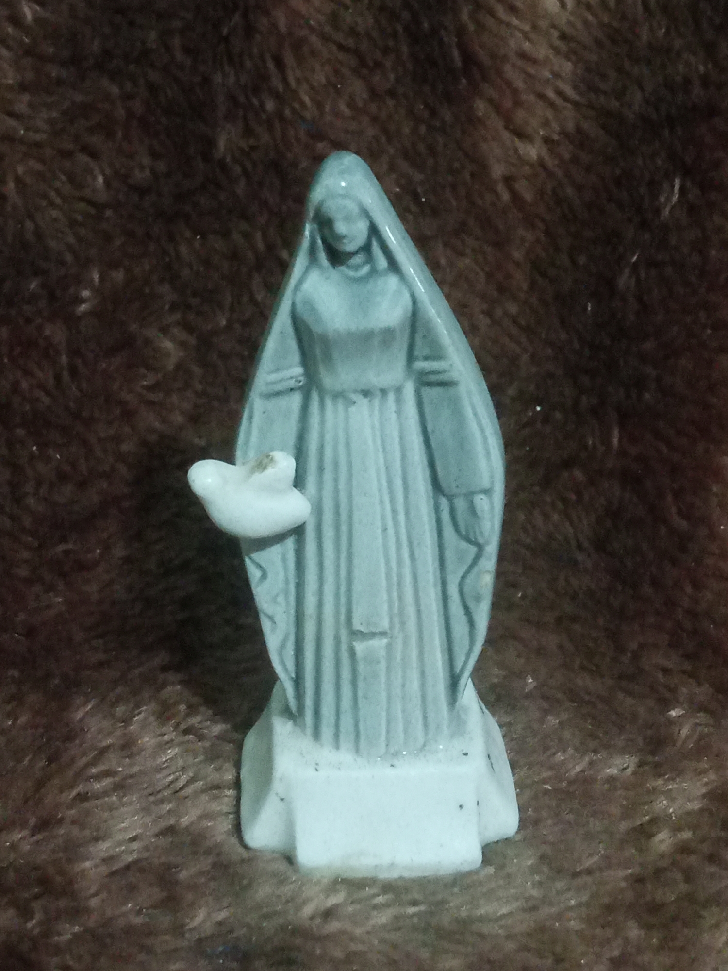 Home collection of figurines, religious items, and graphic tees in Santa Ana