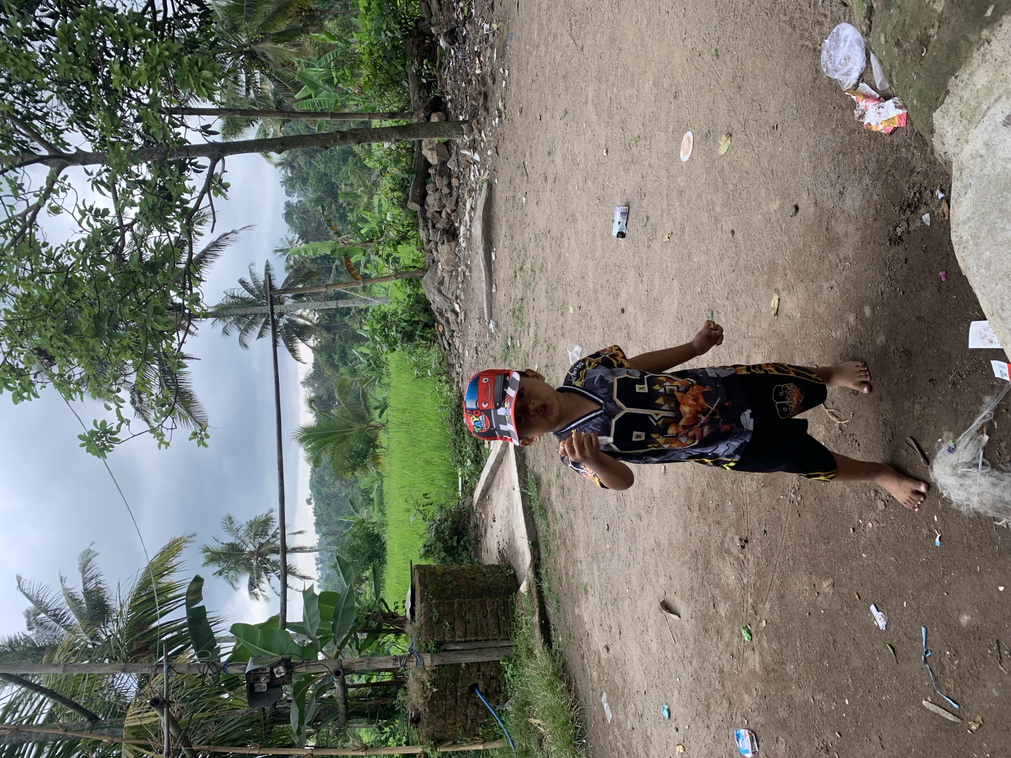 Boy documented in Indonesian village during morning hours
