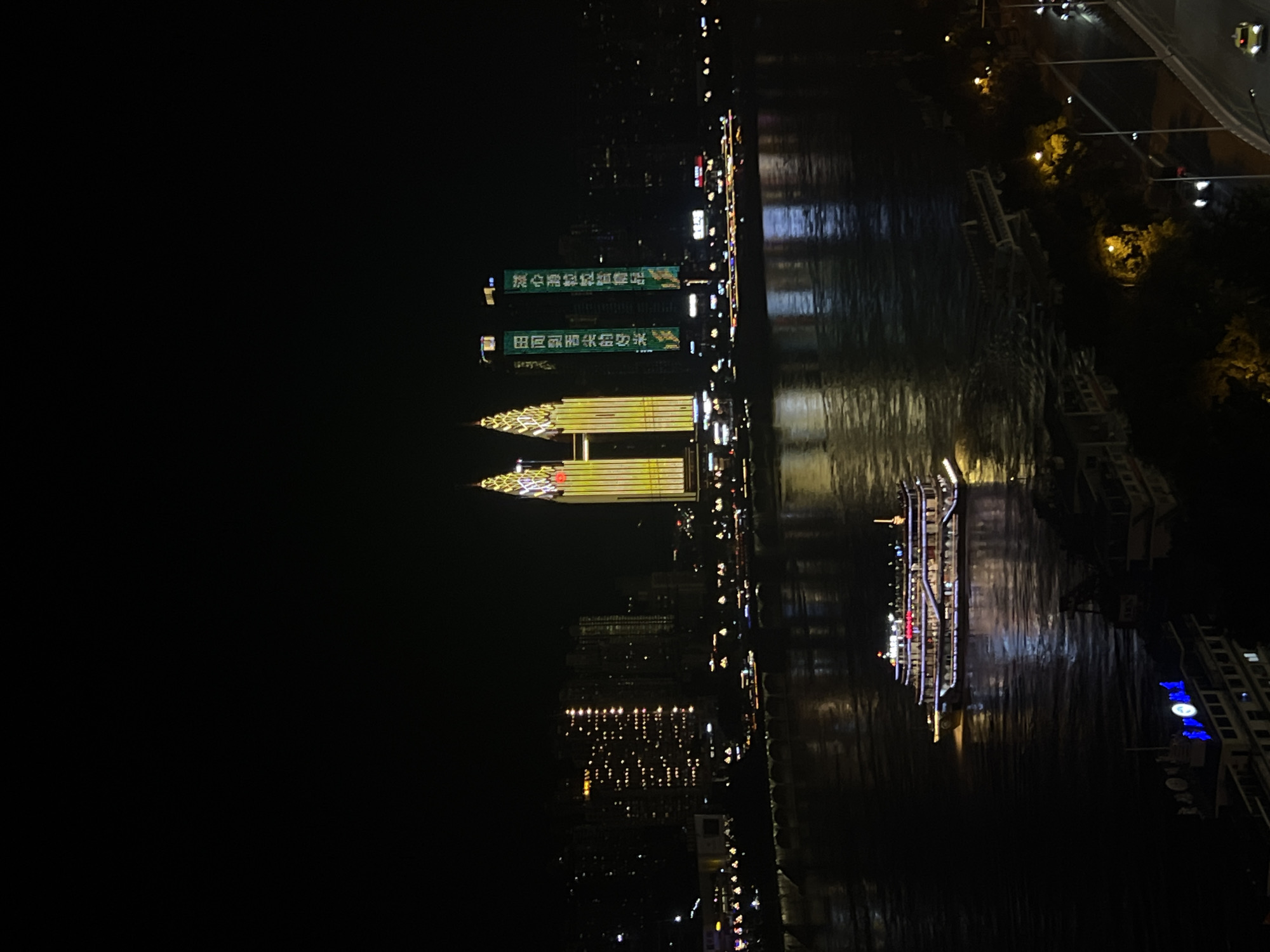 Chongqing's Yuzhong riverfront and Hongyadong complex lit up at night