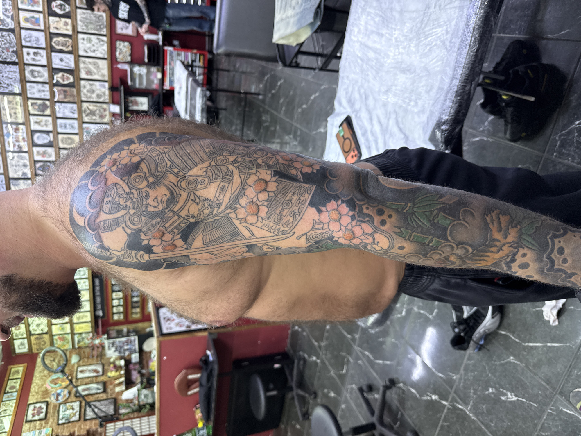 Tattooed arm documented at Moscow tattoo parlor