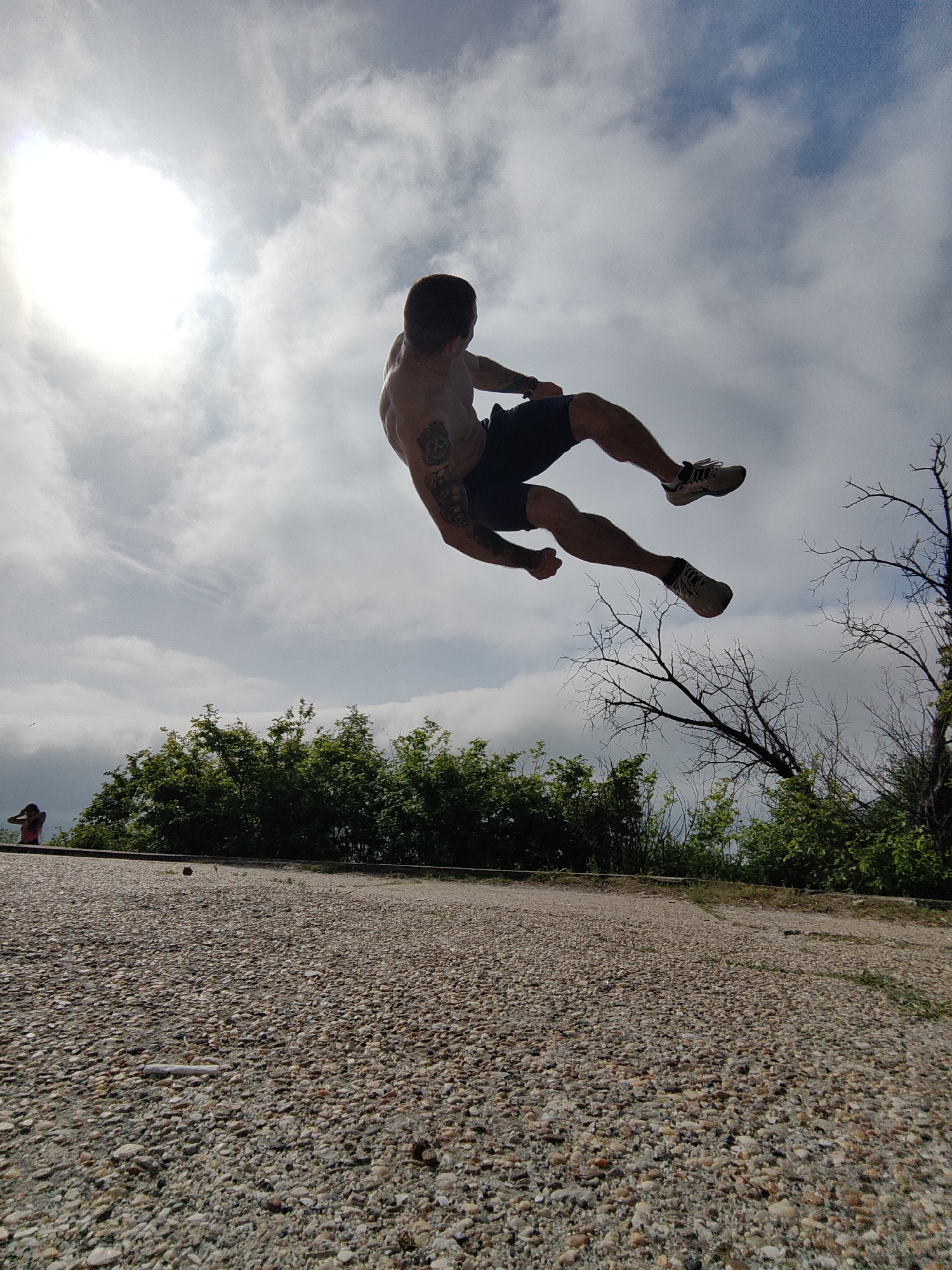 Man performs morning acrobatics near Soviet friendship monument in Varna