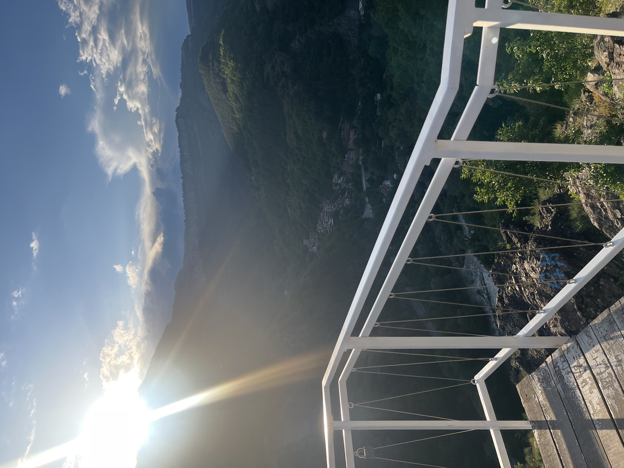 Visitor documents sunset views and cat encounter at mountain observation deck