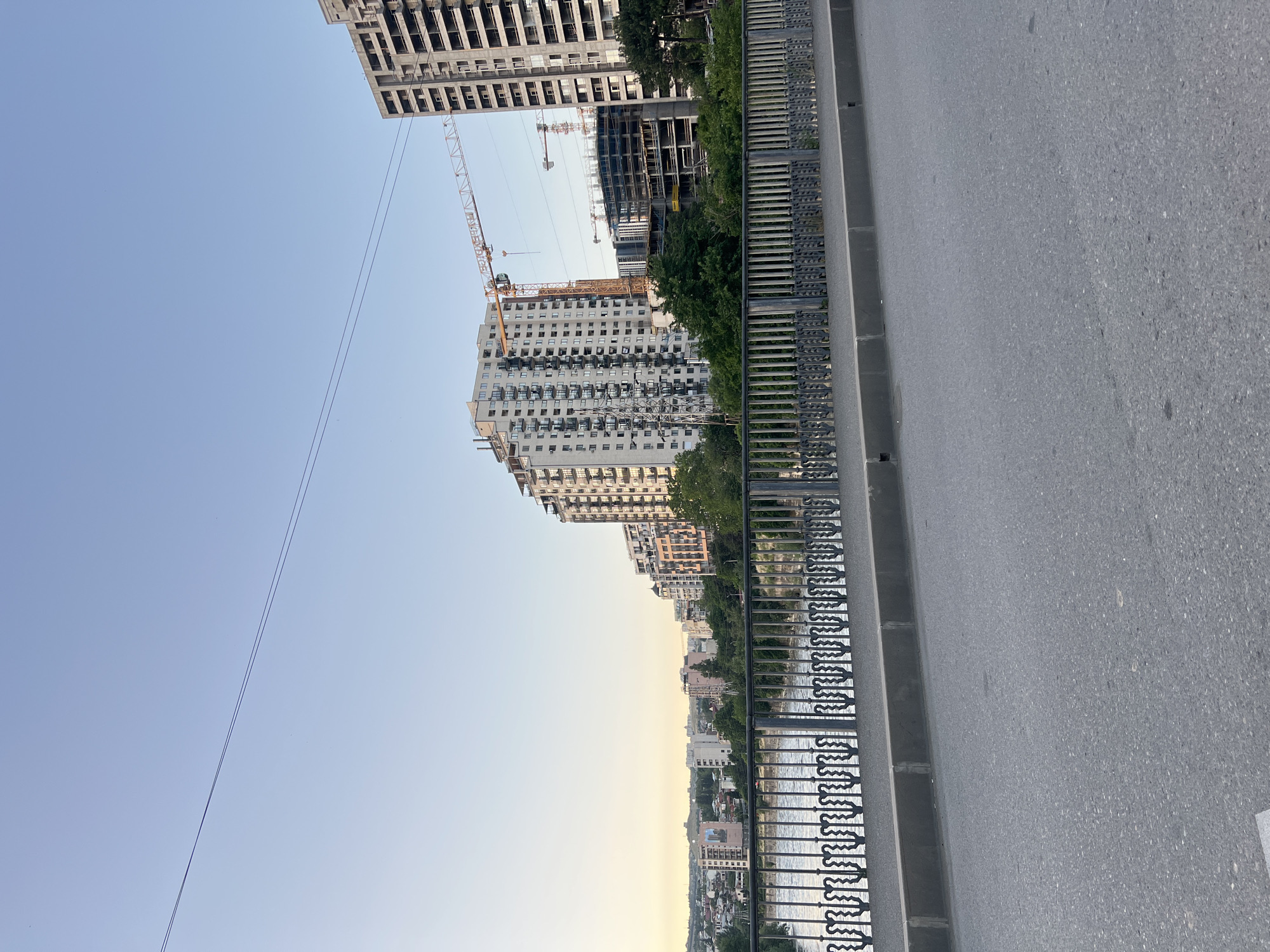 Sunset views across Tbilisi from elevated roads and bridges