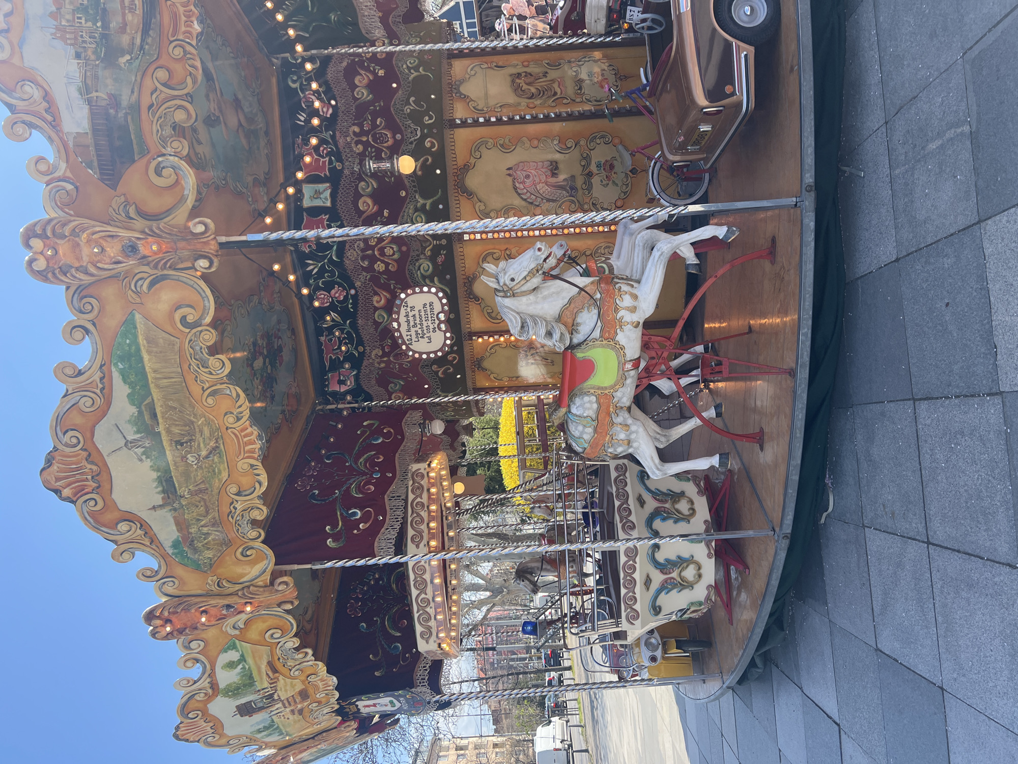 Spring morning scenes captured around illuminated carousel in Sofia