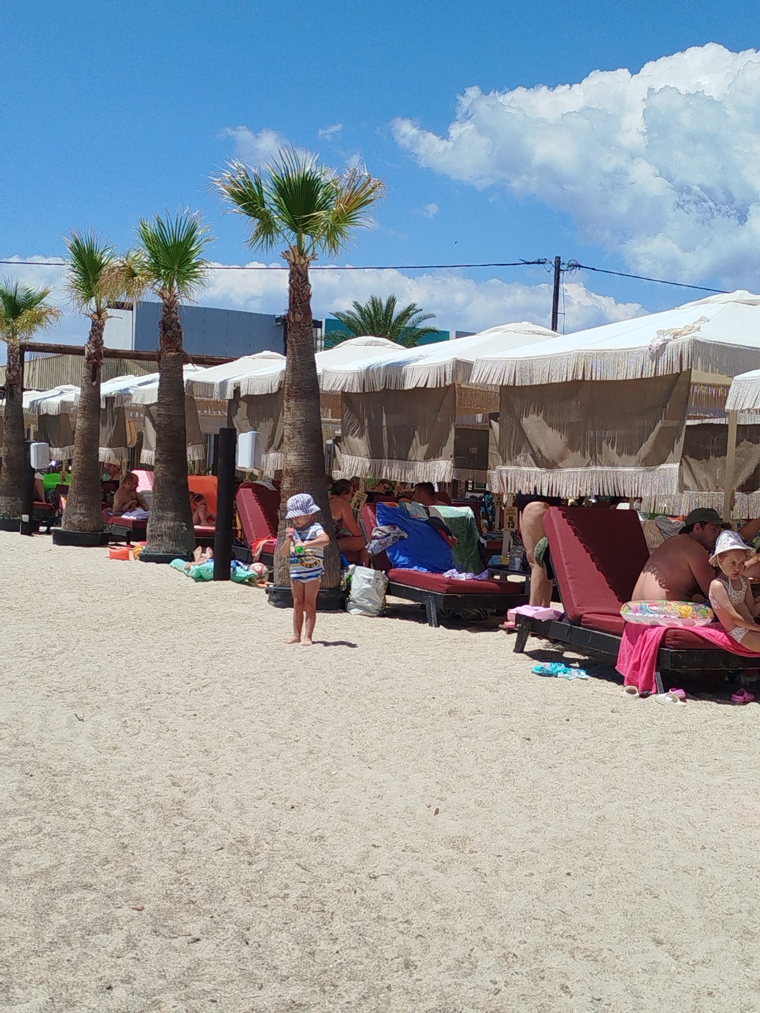 Busy summer beach day on the Sithonia coast, Greece