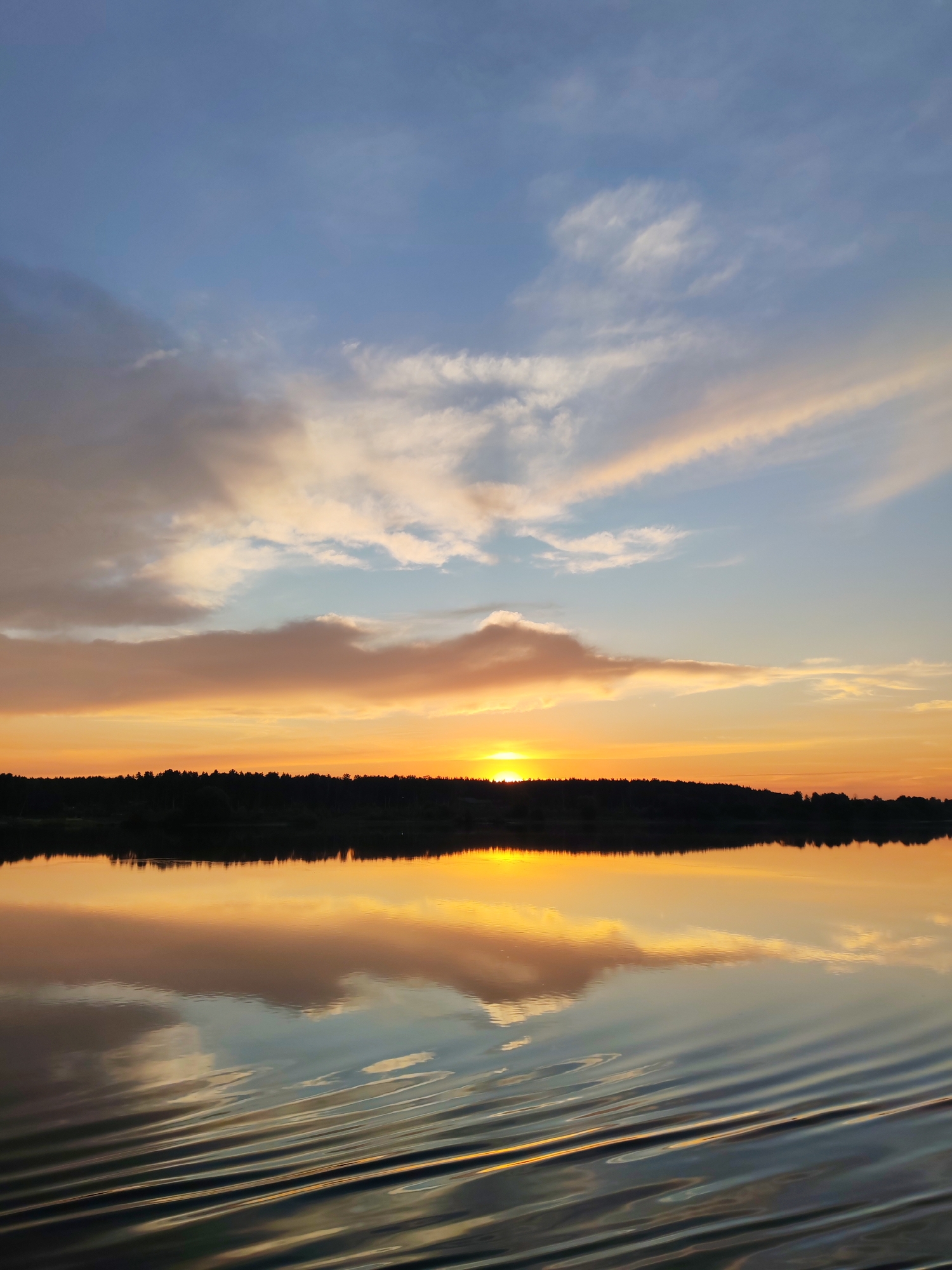 Sunset captured over water near Terekhovo, Russia