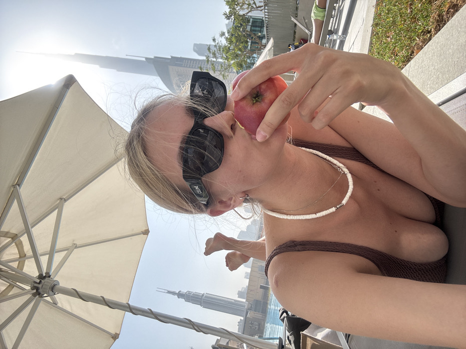 Poolside relaxation observed in Downtown Dubai under bright sunlight