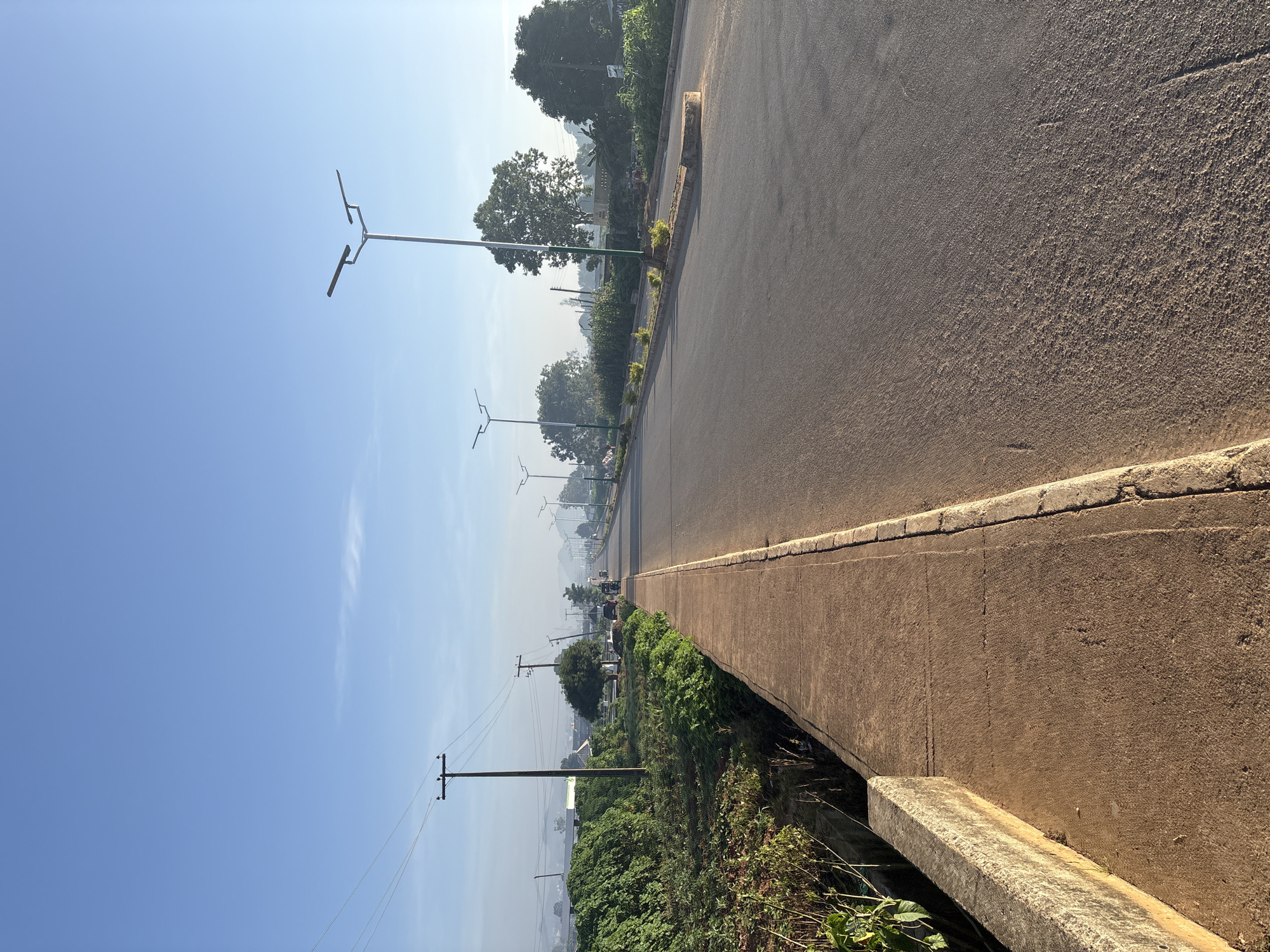 Morning street scenes along a quiet road in Bukuru, Nigeria