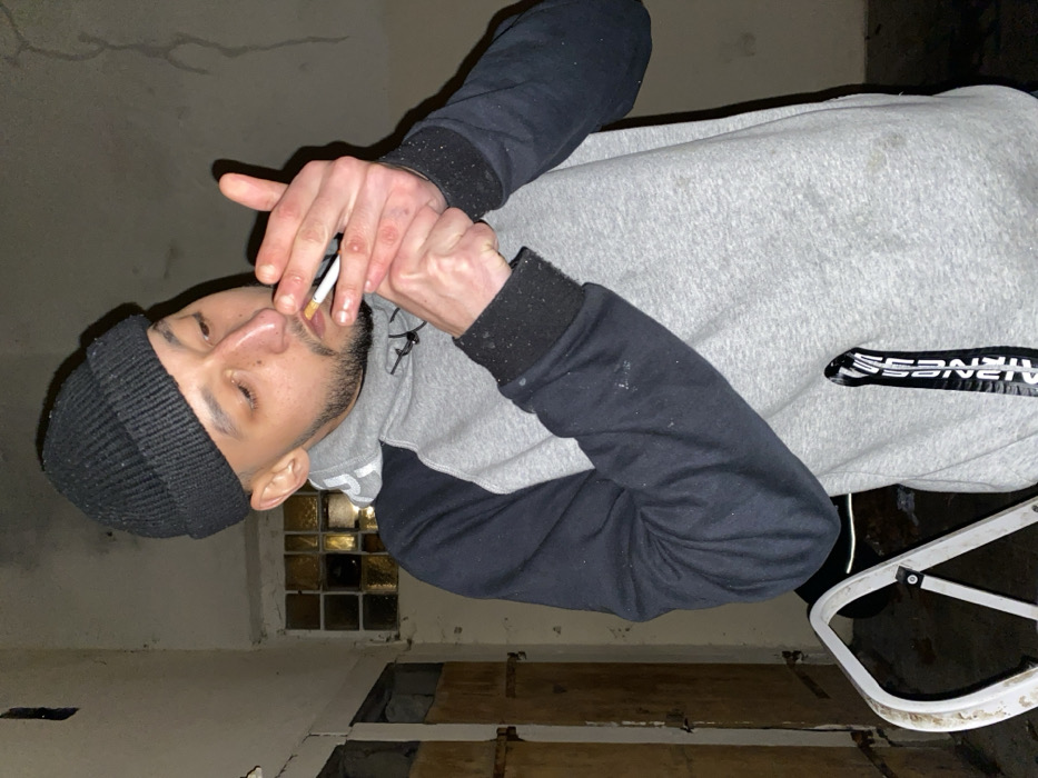 Young adults gather, smoke, pose with scooters in Schiltigheim