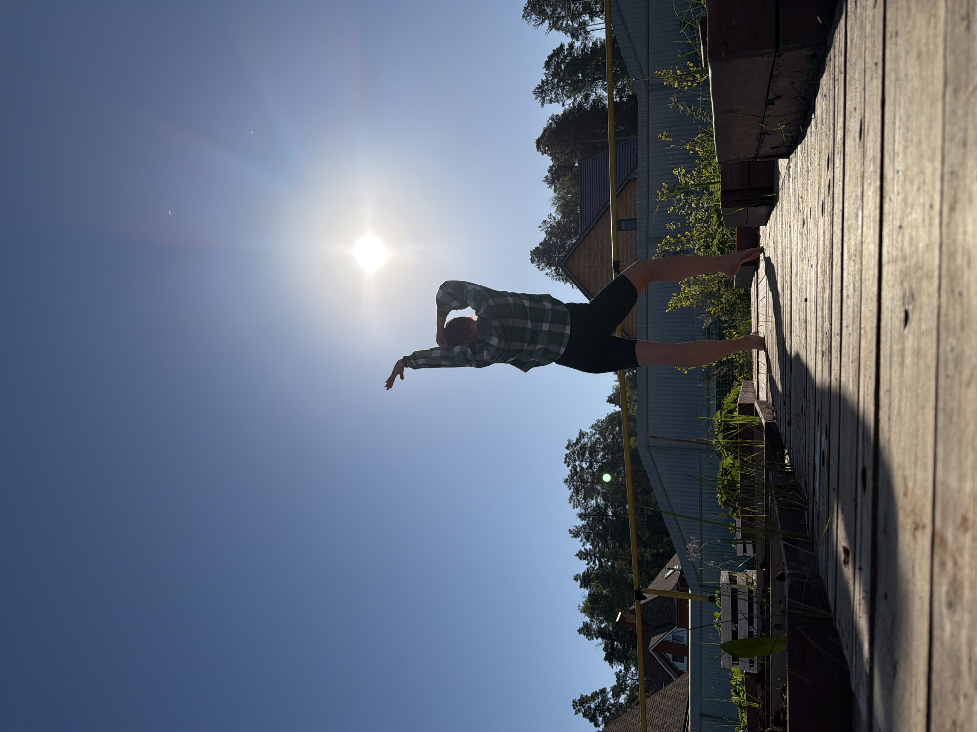 Morning yoga session observed on wooden platform in Chaikovsky