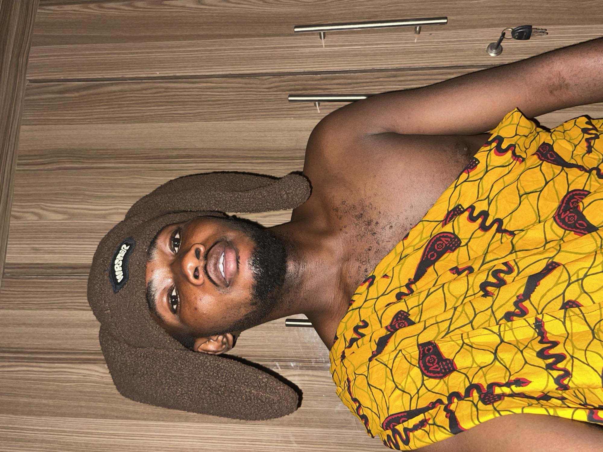 Young man photographed in casual indoor portraits in Nigeria