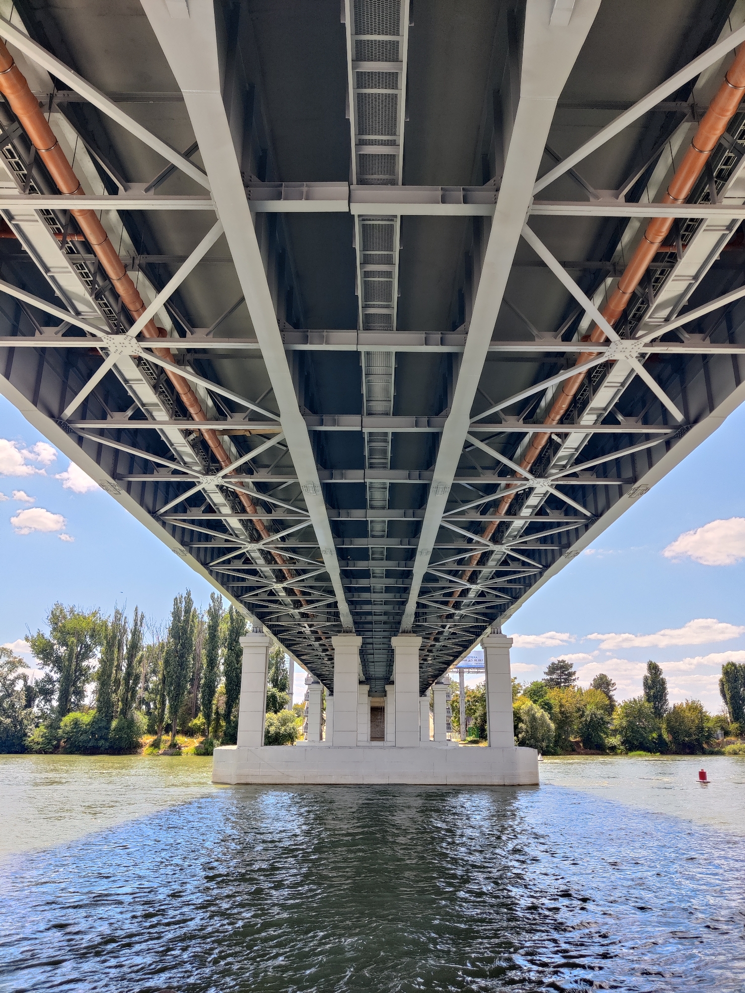 Motorboat passes under the Old Kuban Bridge, Krasnodar