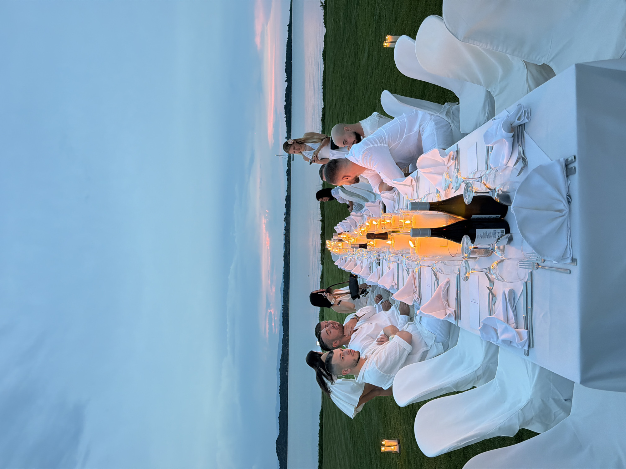 Outdoor dinner party held at dusk in Sithonia, Greece