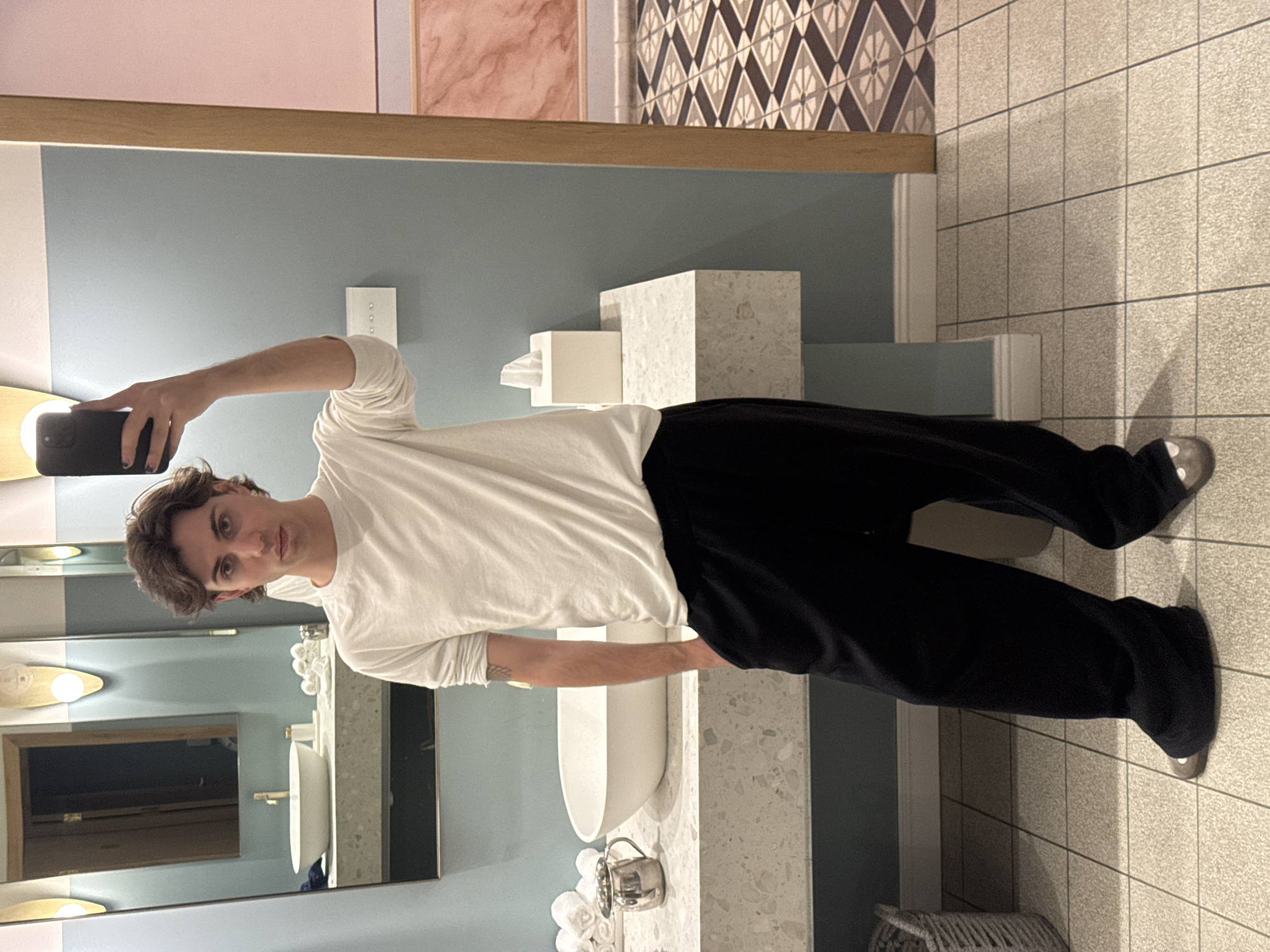 Young man takes bathroom selfie in Tel Aviv