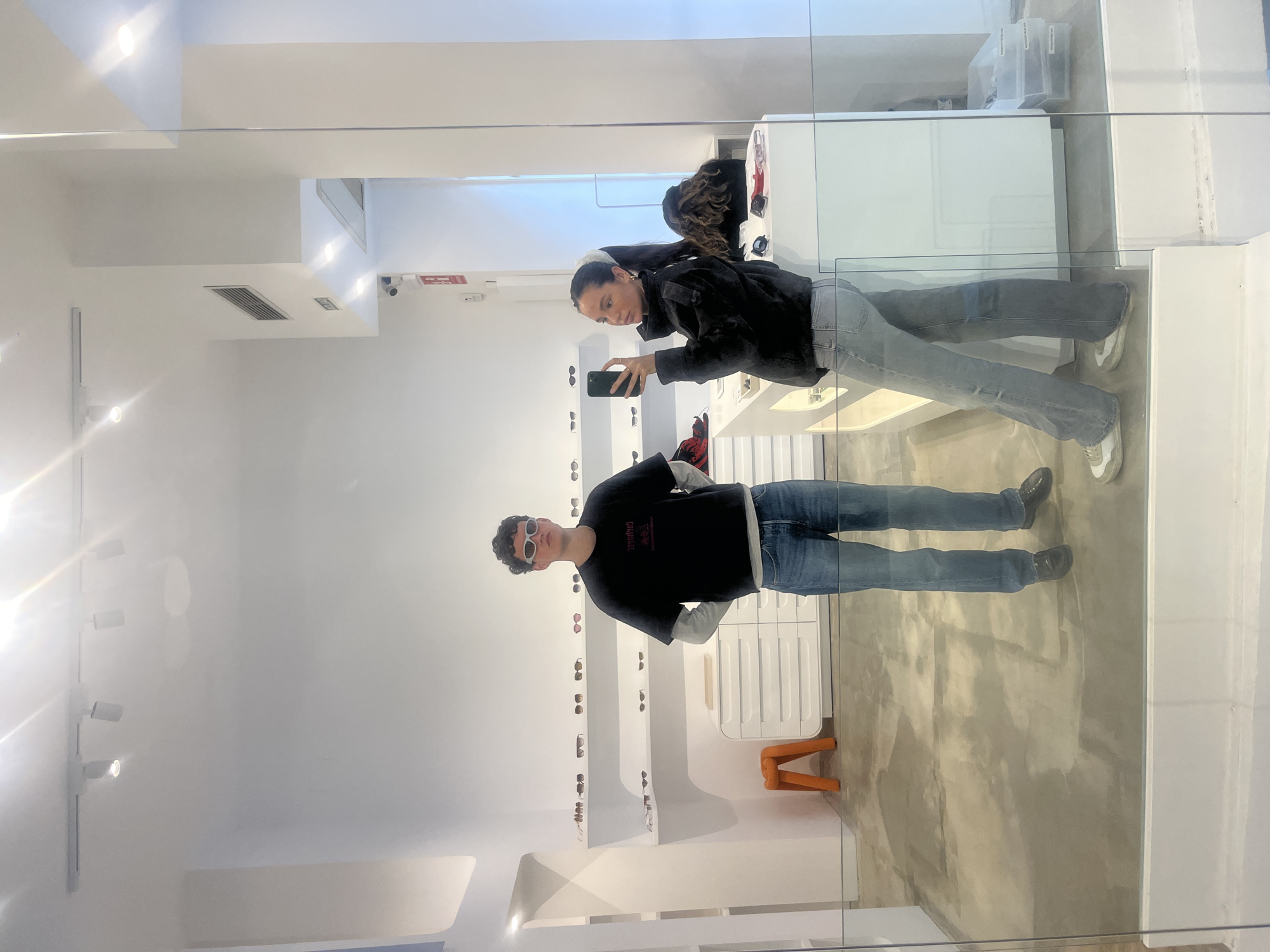 Couple shops for eyewear in Madrid store