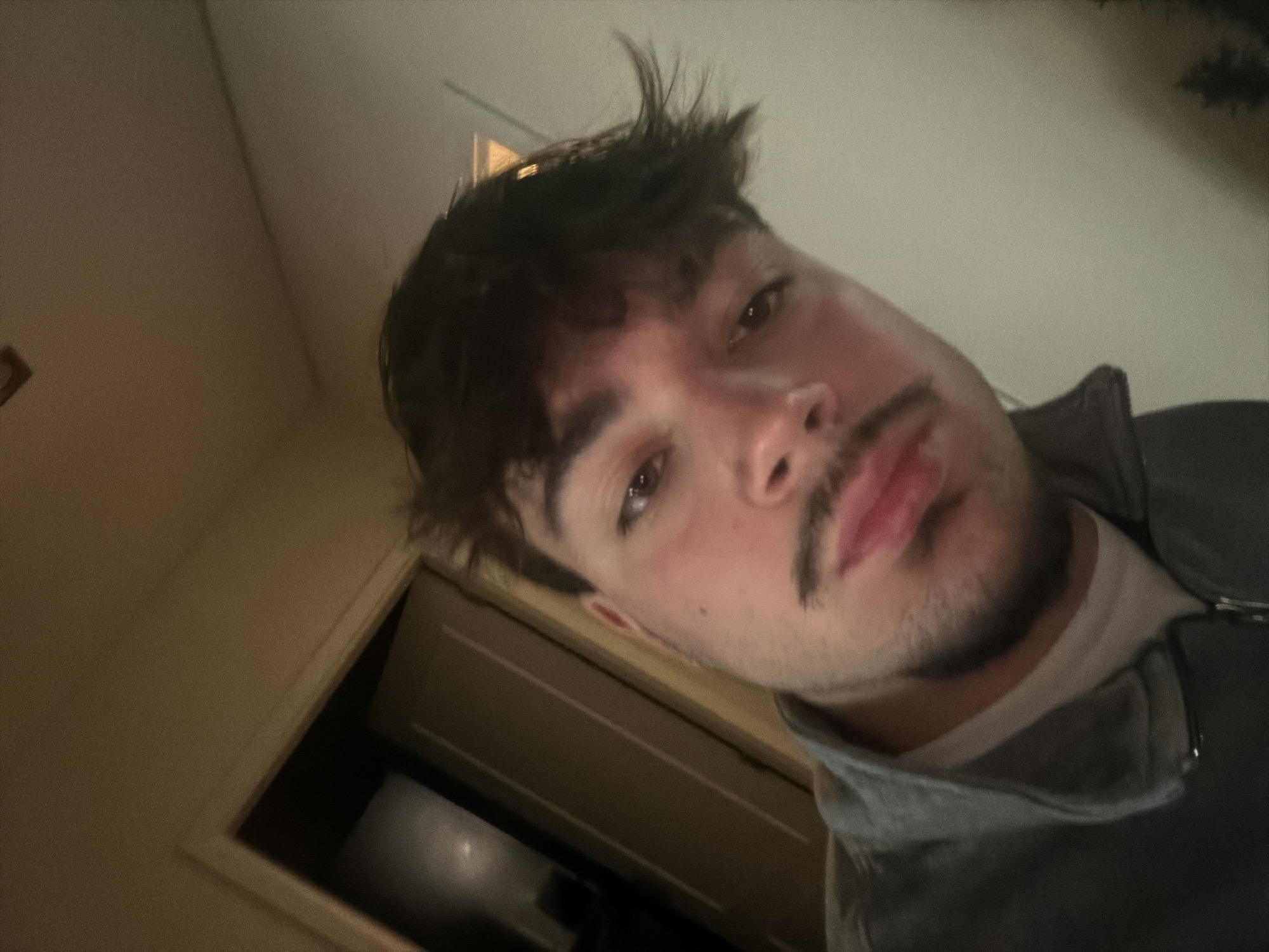 Young man takes indoor selfie in Vila Real, Portugal