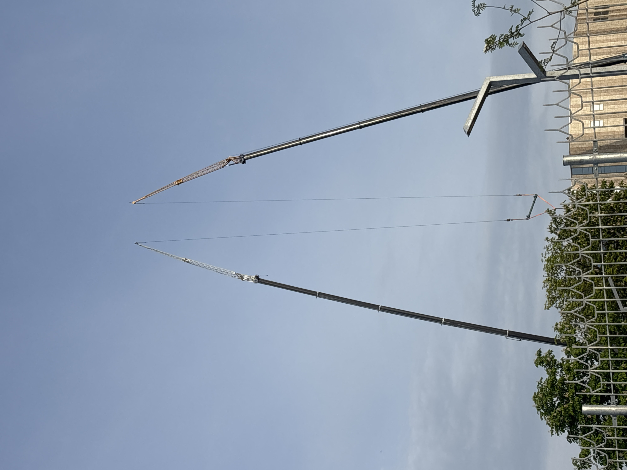 Construction cranes operate along Svislach River in central Minsk