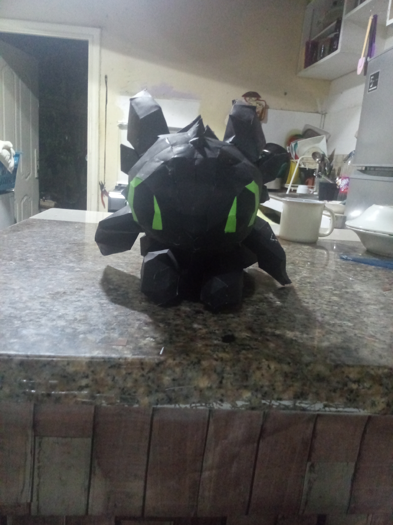 Papercraft figures displayed on Venezuelan kitchen counter