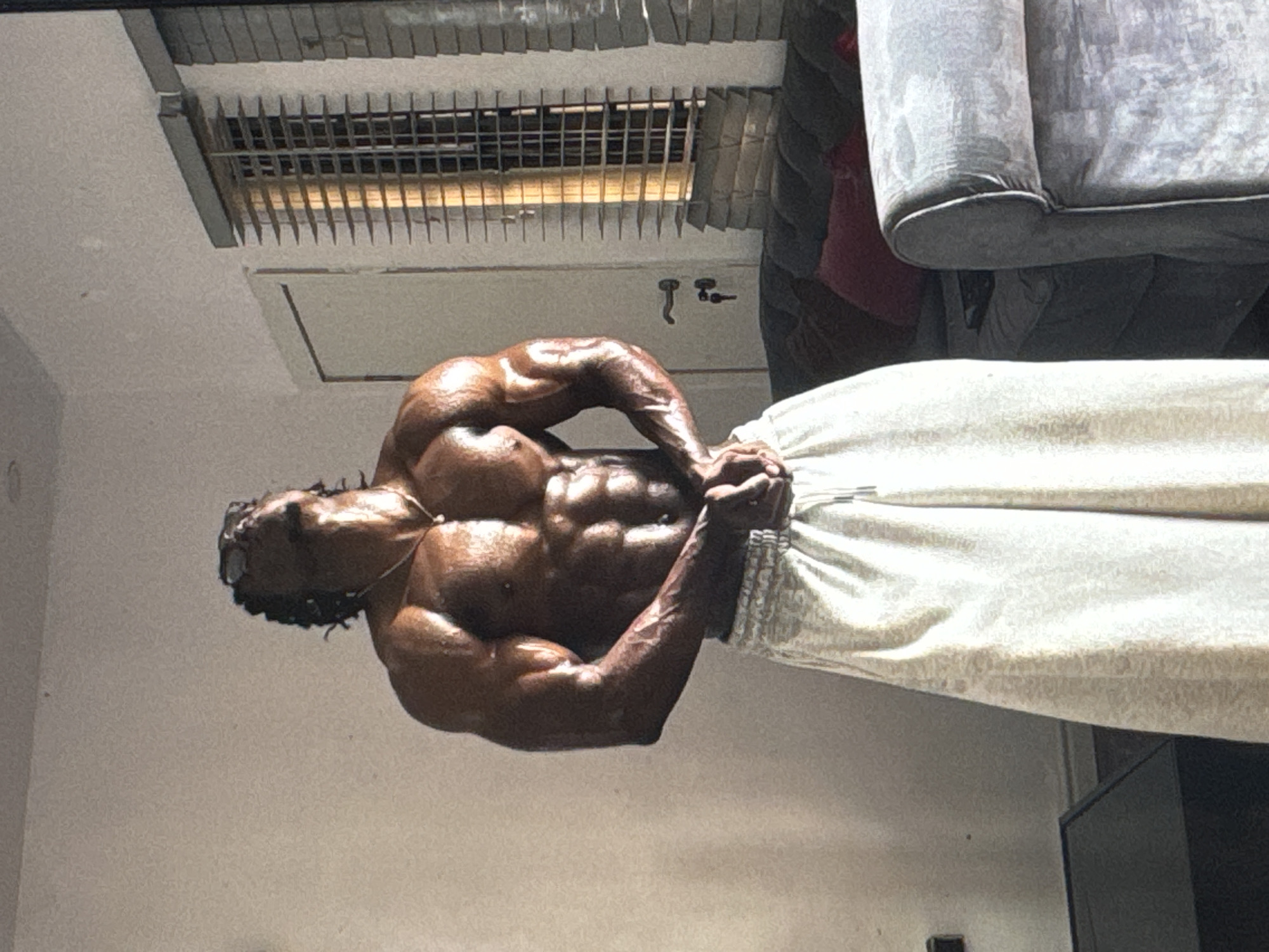 Man poses, flexes in mirror in Awka residence
