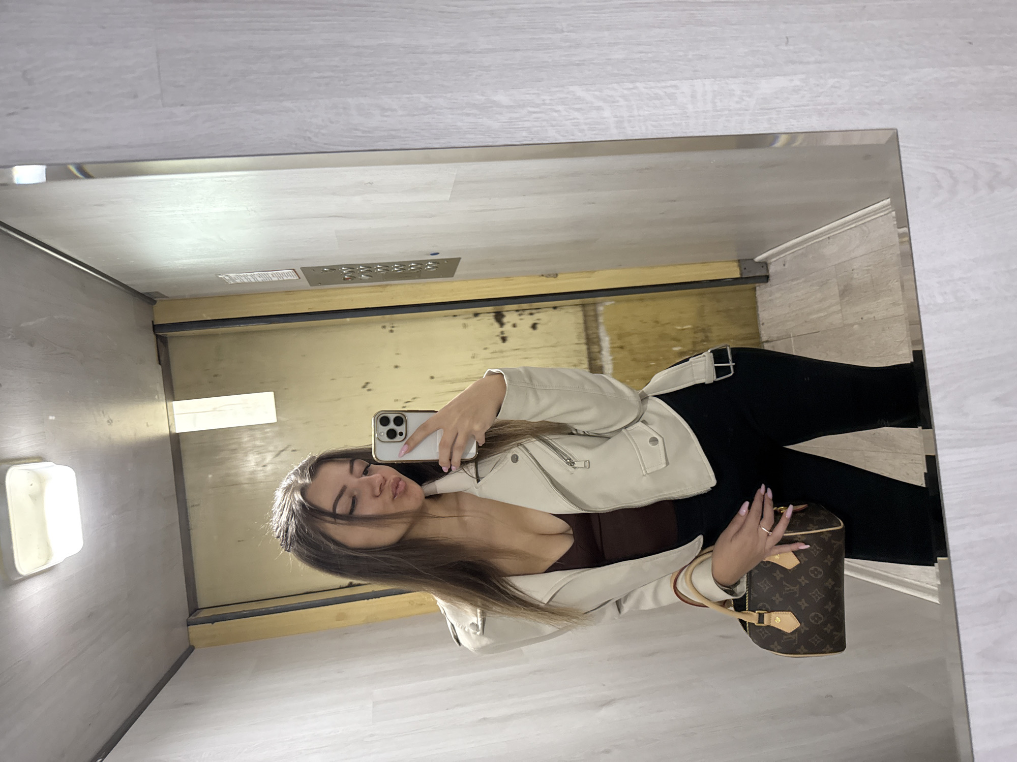 Woman takes mirror selfie in Sofia apartment