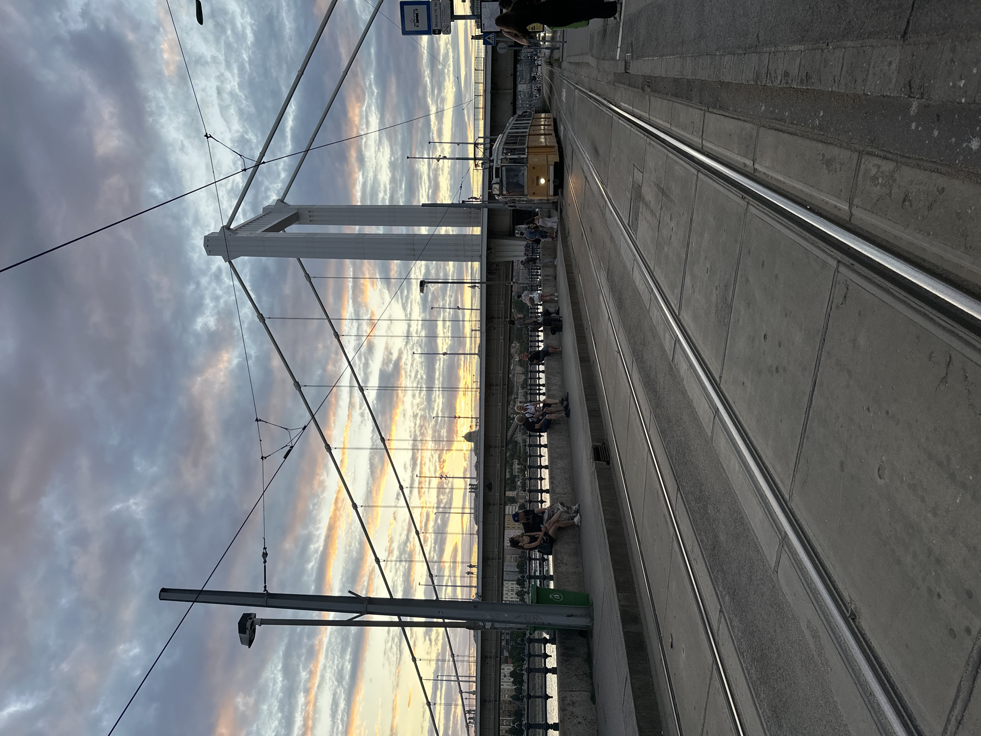 Budapest at dusk: trams, the Chain Bridge, and Gellért Hill