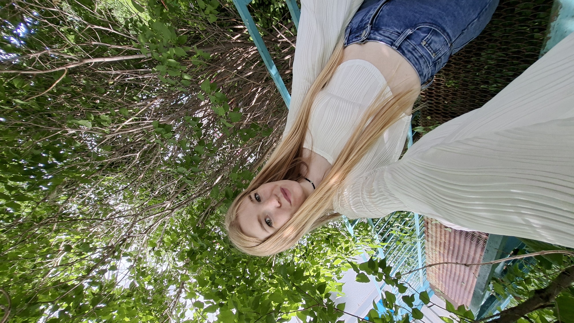 Woman takes selfies on stairs in Chaikovsky, Russia