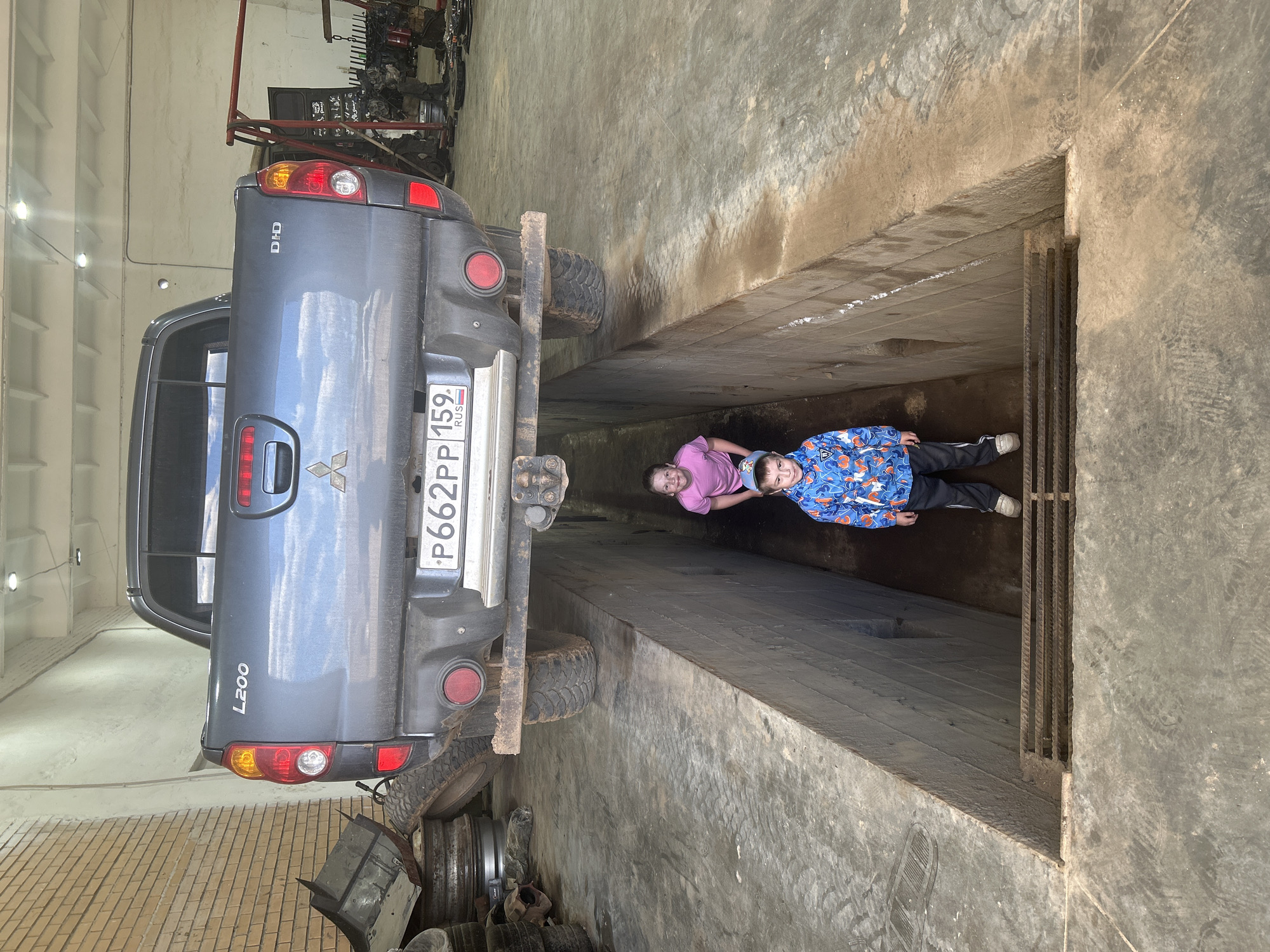 Family visit to auto shop in Chaikovsky, Russia