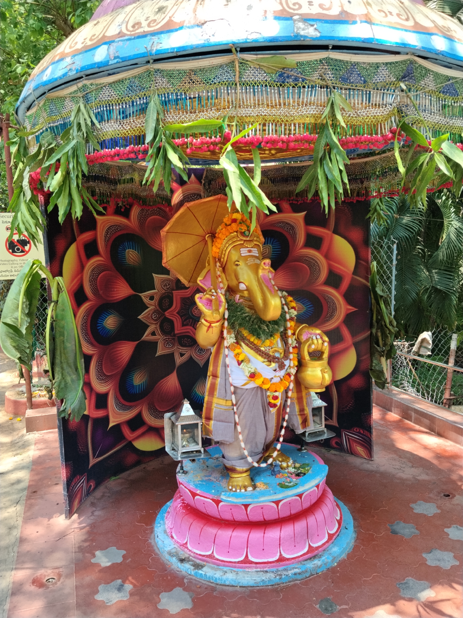 Decorated Ganesha statue observed in Puttaparthi with ceremonial garlands