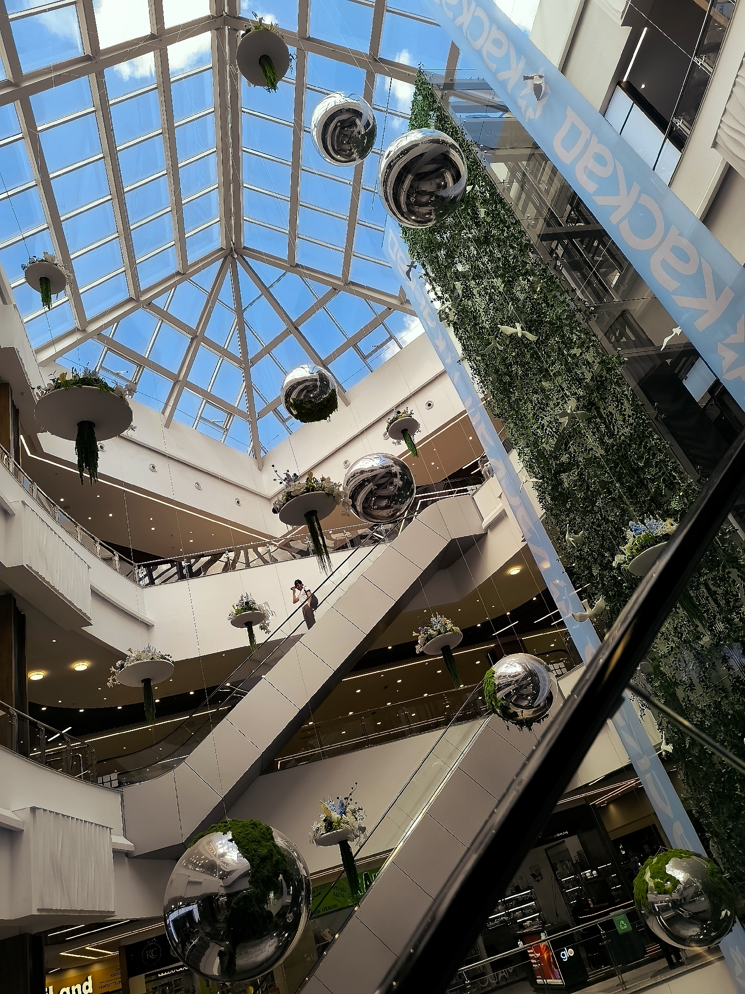 Street-level and indoor scenes across central Qarağandı on a summer morning