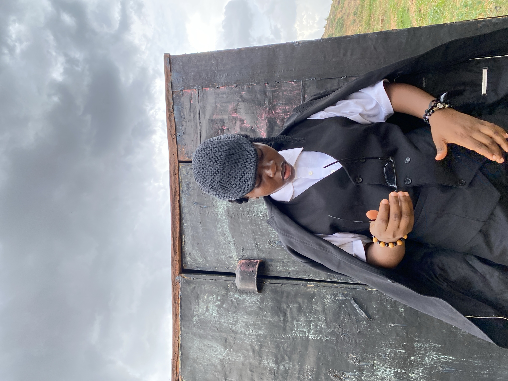 Formal portrait session at weathered metal structure in Gwong