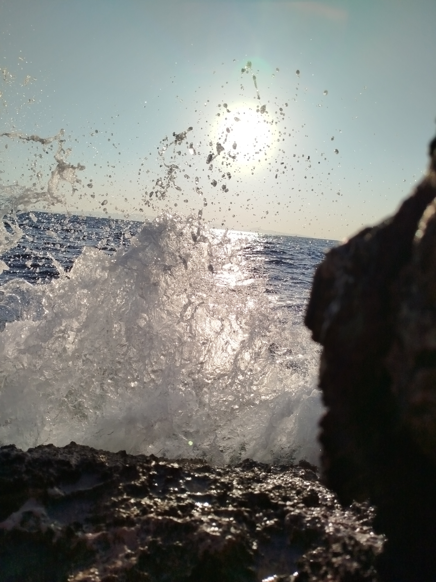 Morning at Karaburun's rocky Aegean shore, waves and wandering