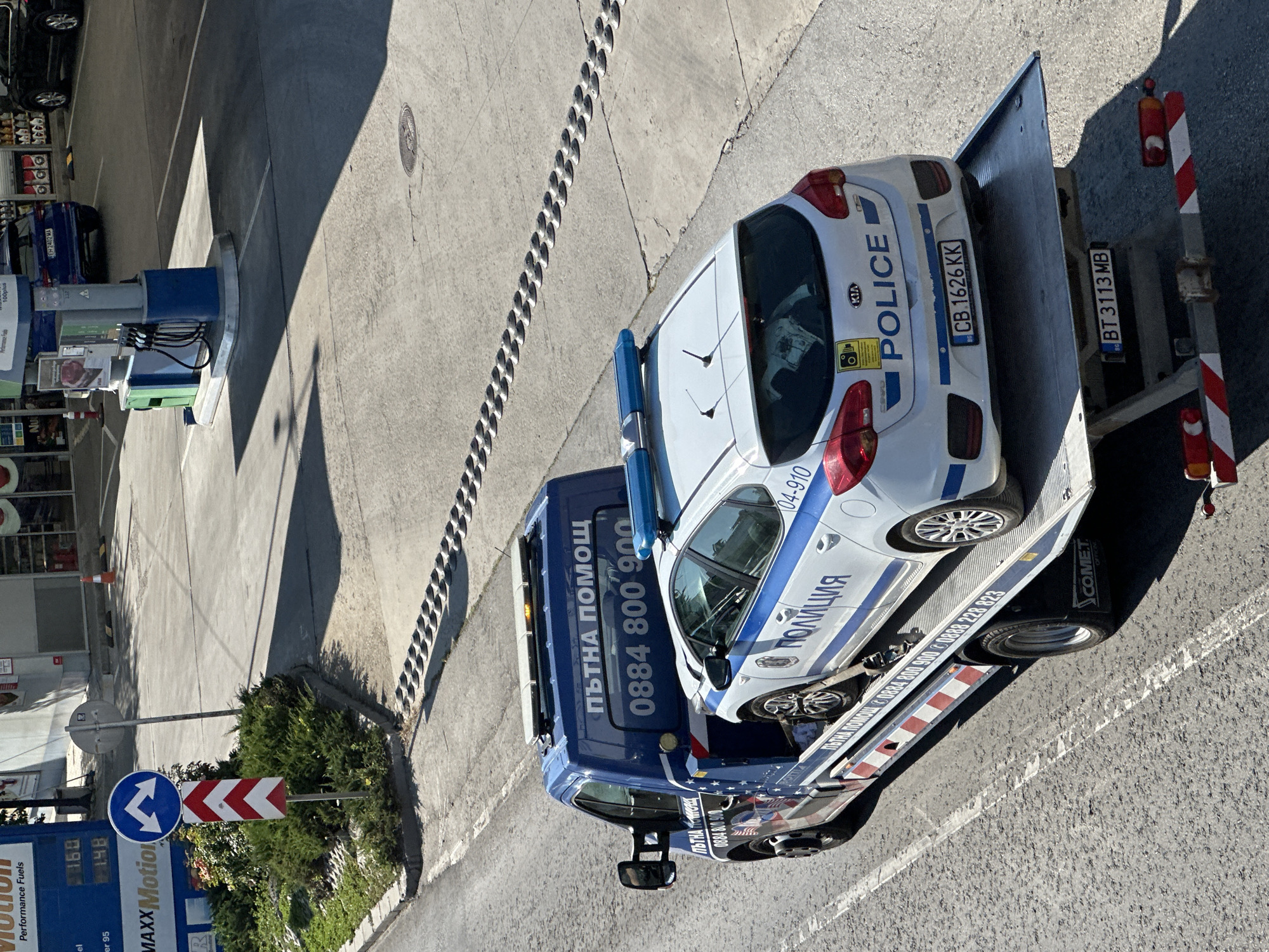 Police car towed in Veliko Tarnovo as Porsche passes nearby