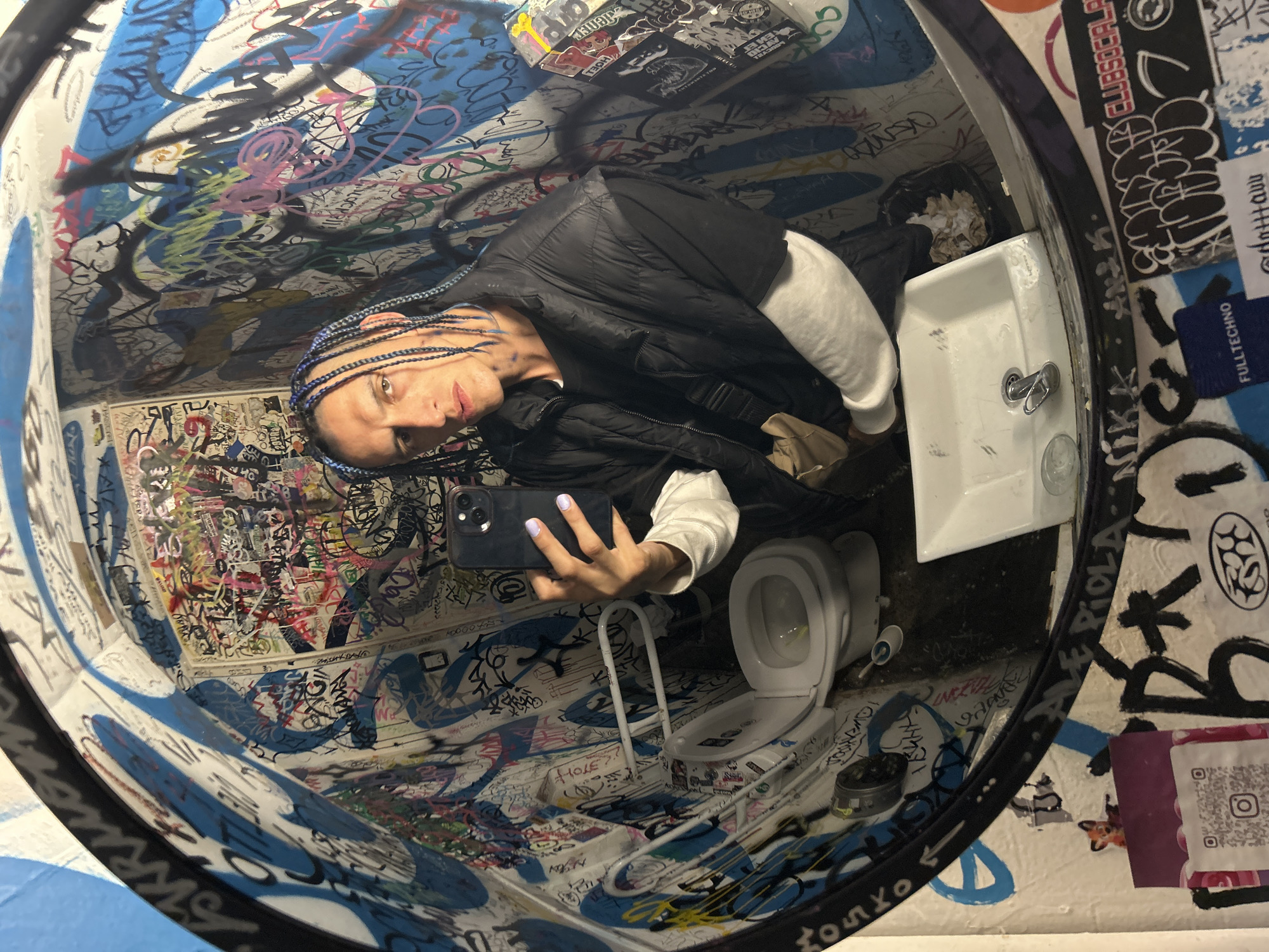 Late-night selfie session documented in Buenos Aires restroom