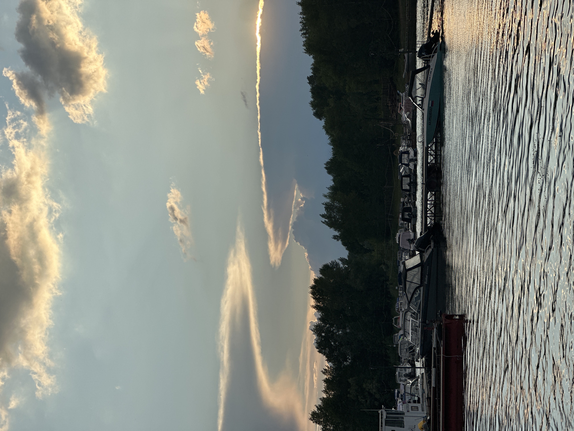 Boats moored at a Volga River marina during sunset