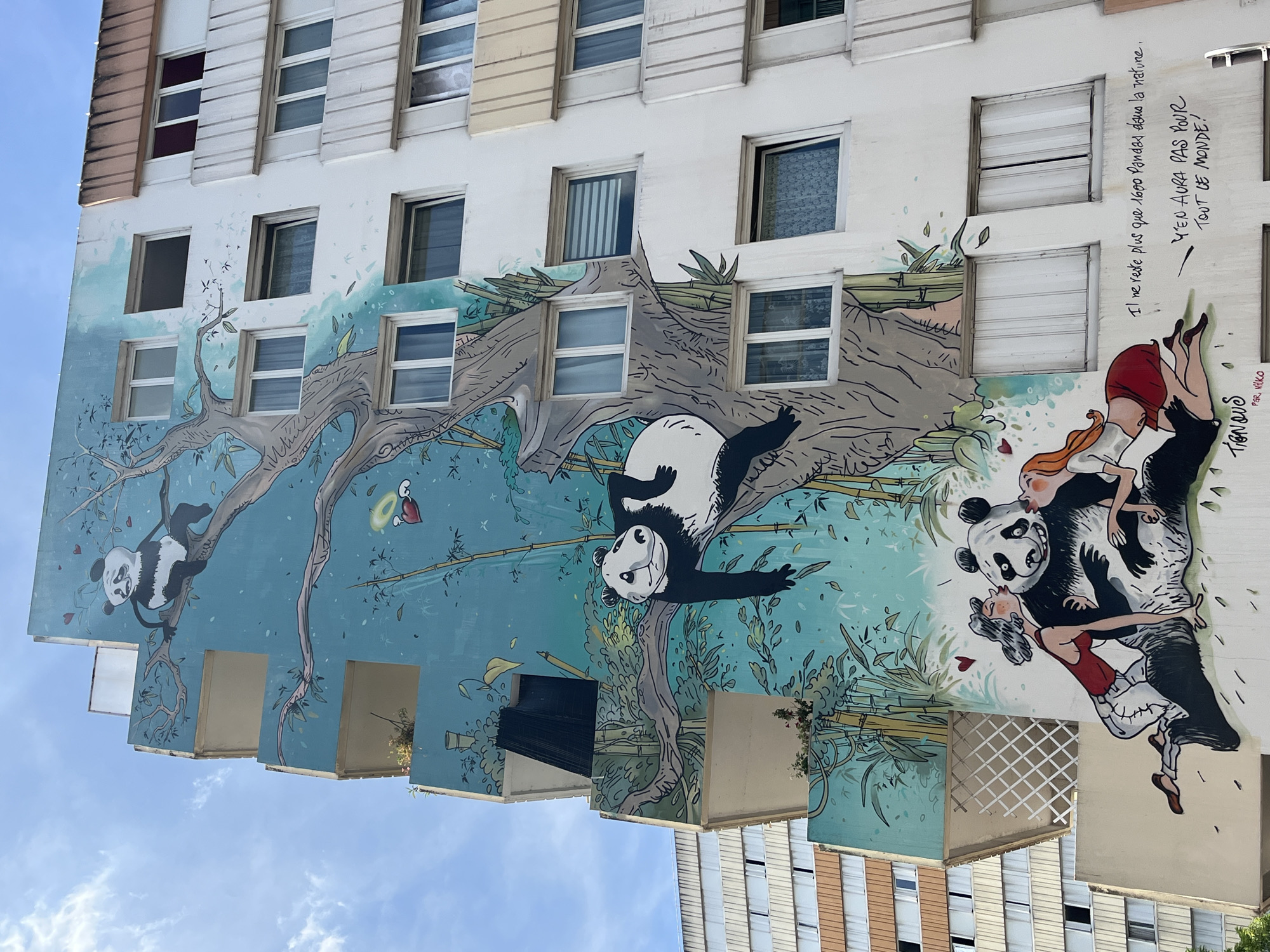 Paris street murals and everyday scenes on a sunny July morning