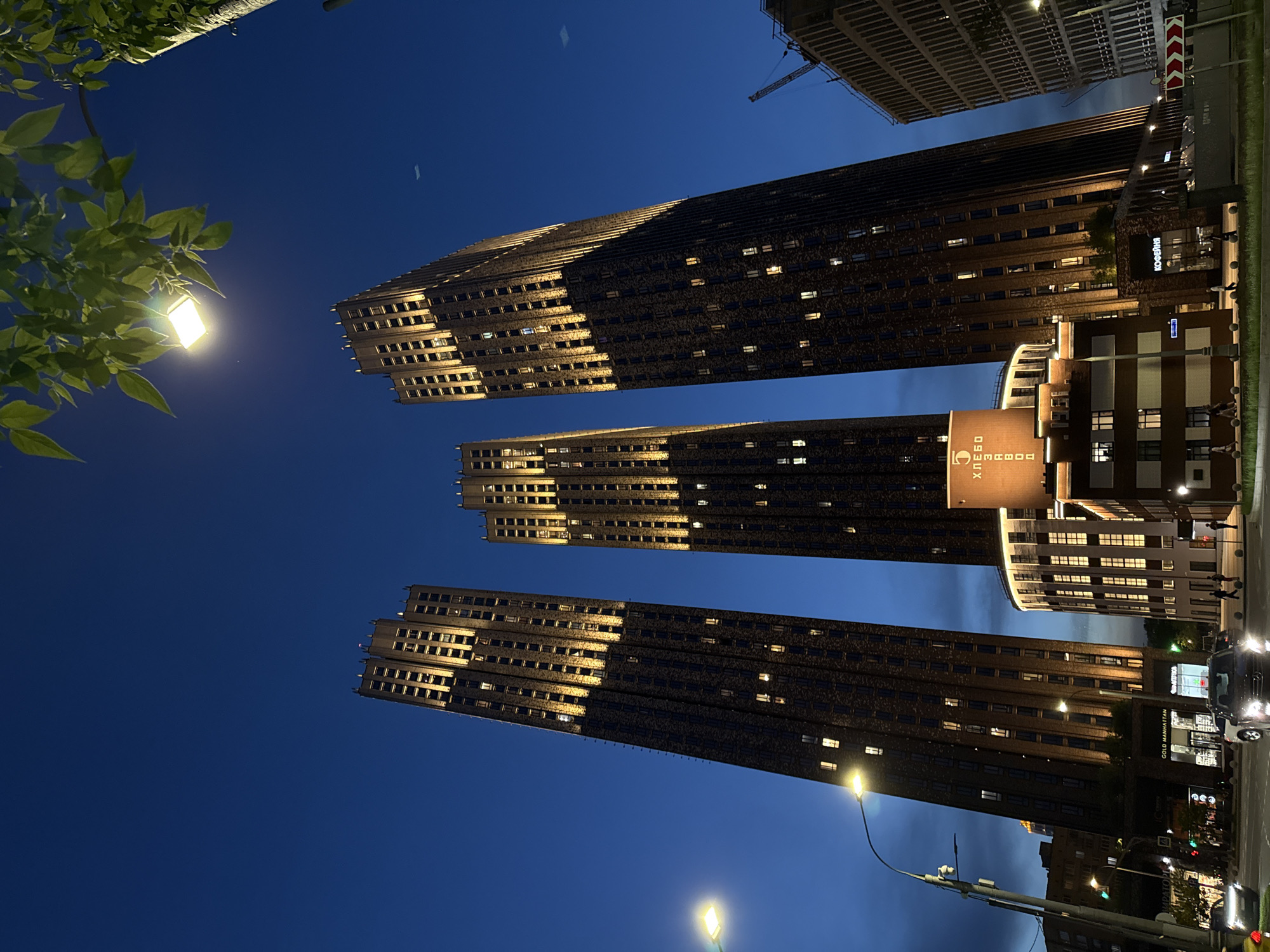 Moscow skyscrapers illuminated at night, captured by witness