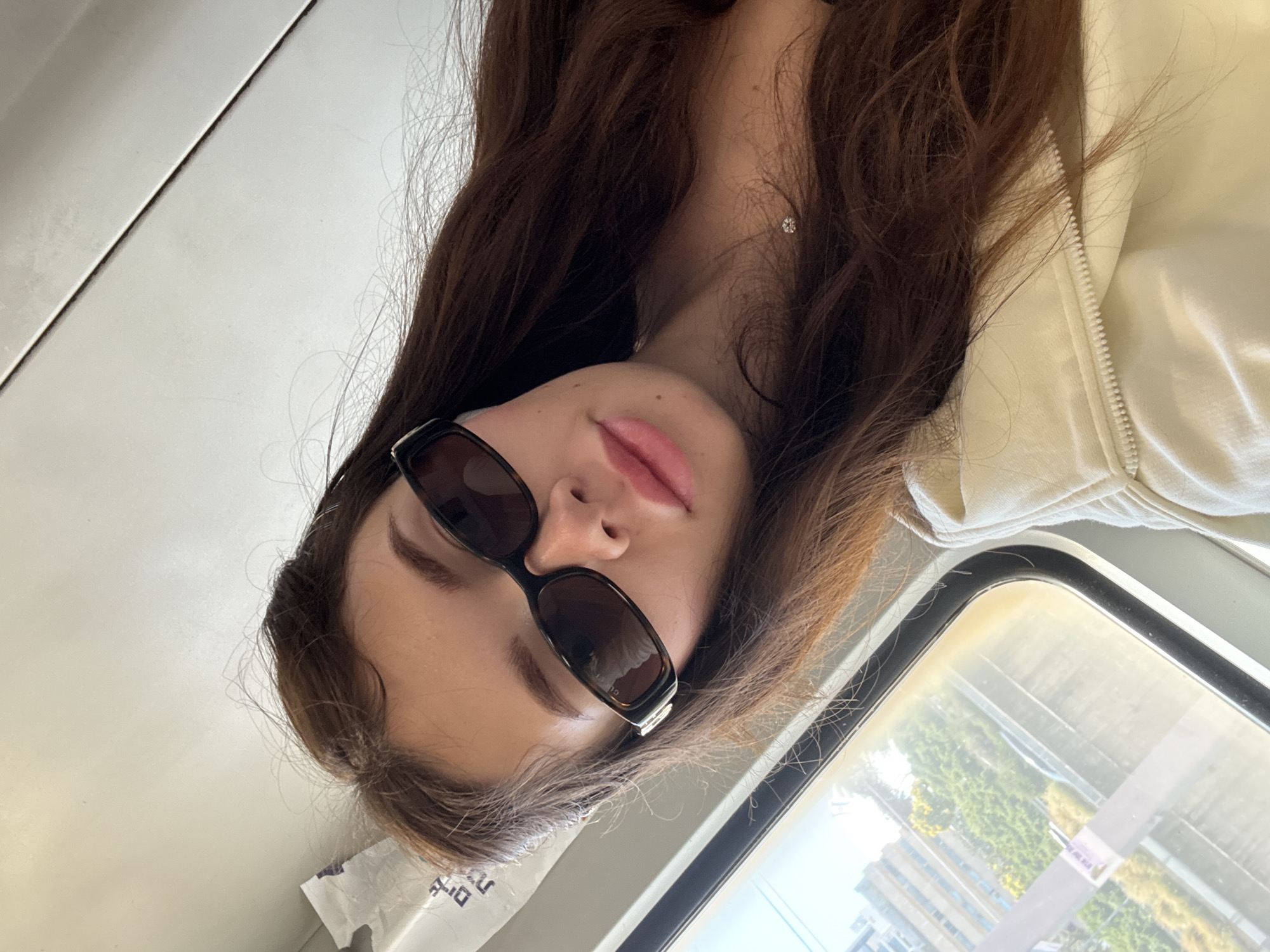Woman takes selfie on public transport in Tel Aviv