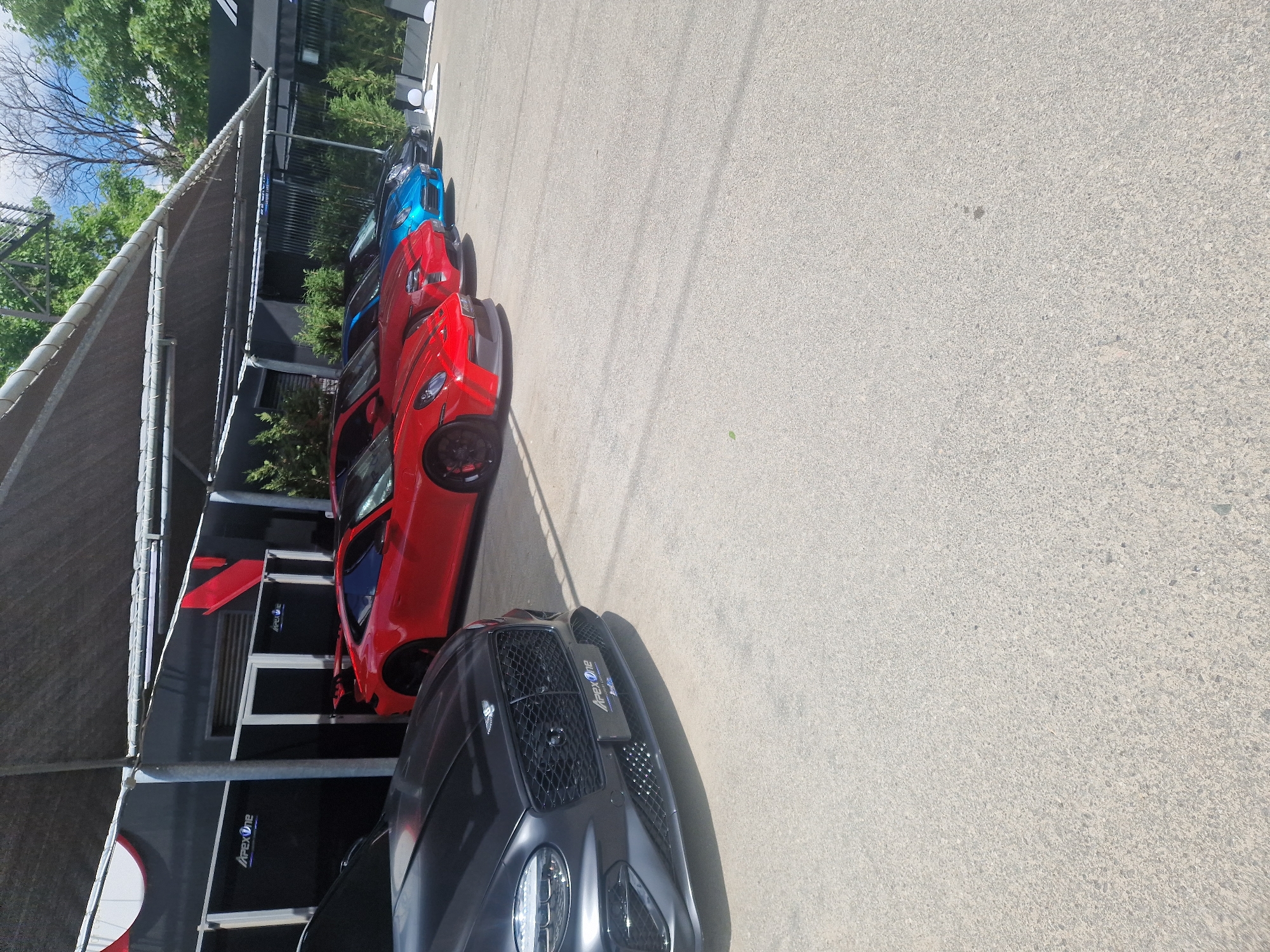 Cars parked under ApexOne-branded covered area